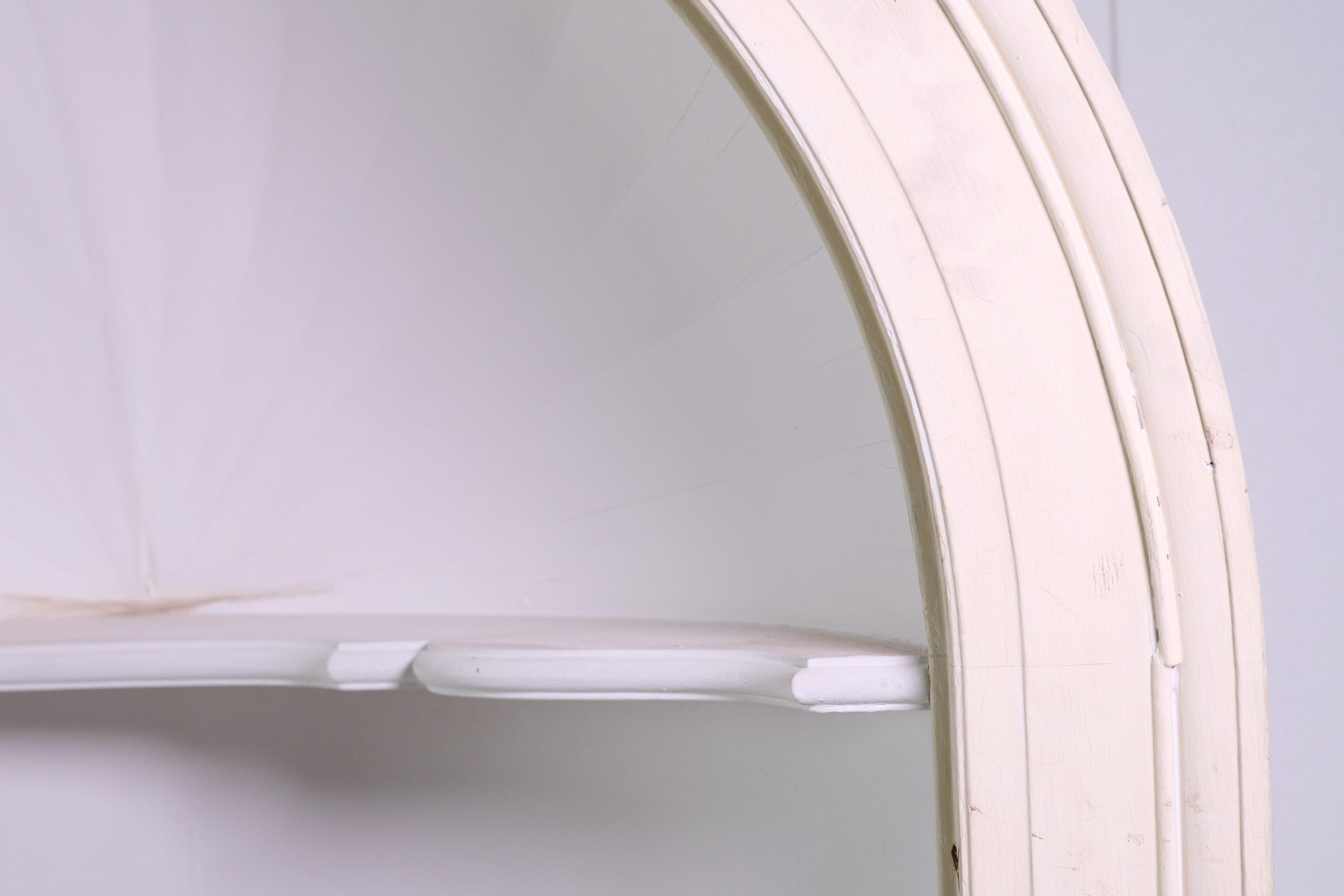 Wood half dome shaped alcove which features a Roman style arch and keystone with an interior shelf. This antique tall, recessed niche has a cream exterior with the interior and keystone painted white. Please note, this item is located in our