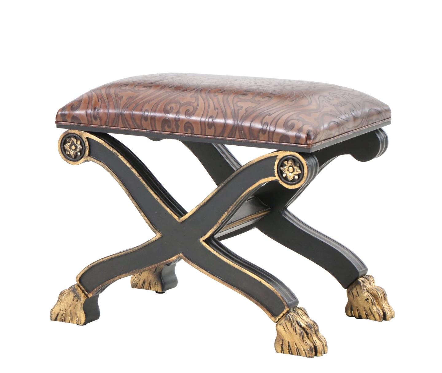A rare and unique Roman style- Empire style- black Curule ottoman with gilt details and carved gilt paw feet 
Lustrous embossed leather design on upholstered seat, perfect aged vintage patina and gilt details...
You will love how this looks in