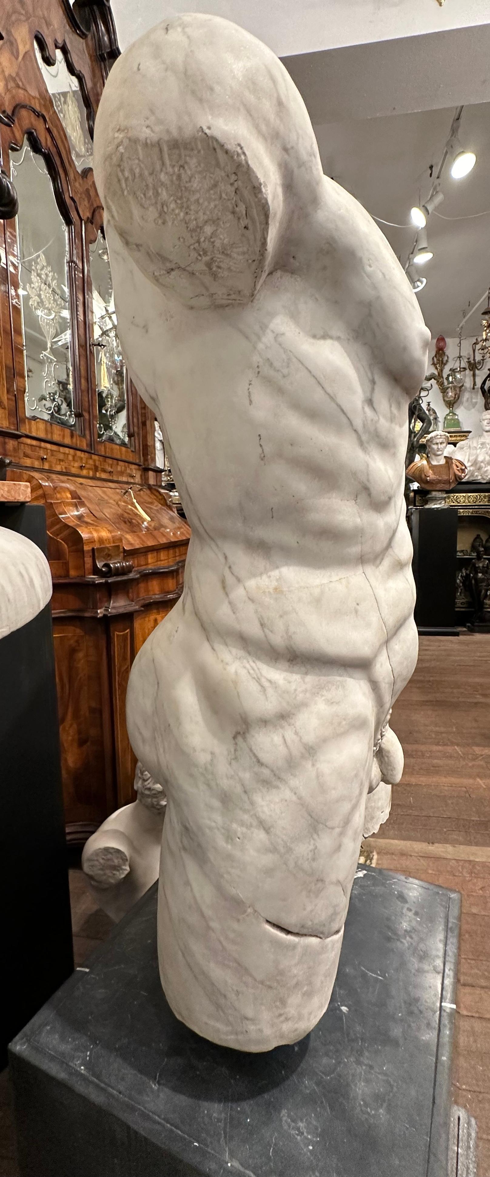 Roman Style Marble Torso On A Black Marble Base In Good Condition For Sale In Southall, GB