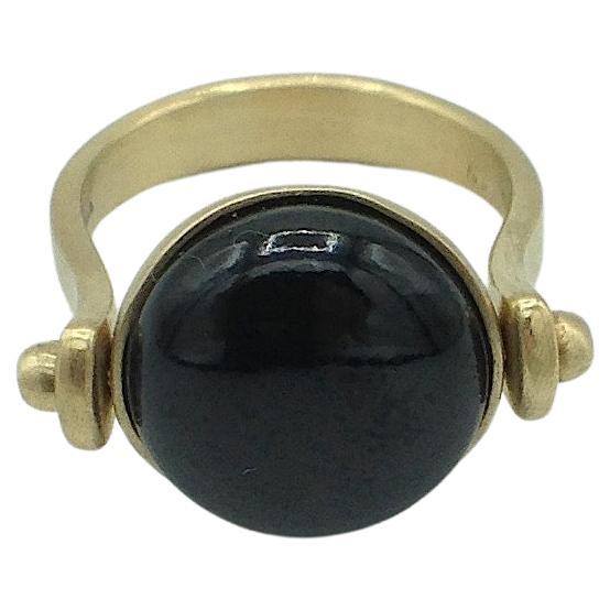 Roman Style Reversible Ring Black Jade Yellow 18 Karat Gold Made in Italy
This ring is inspired by ancient Roman jewelry. They used to wear a ring where its head would be round. There's a black round jade as a button above and if you turn it around