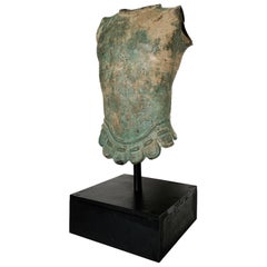 Ancient Roman style sculpture of a torso, in patinated bronze, with display base