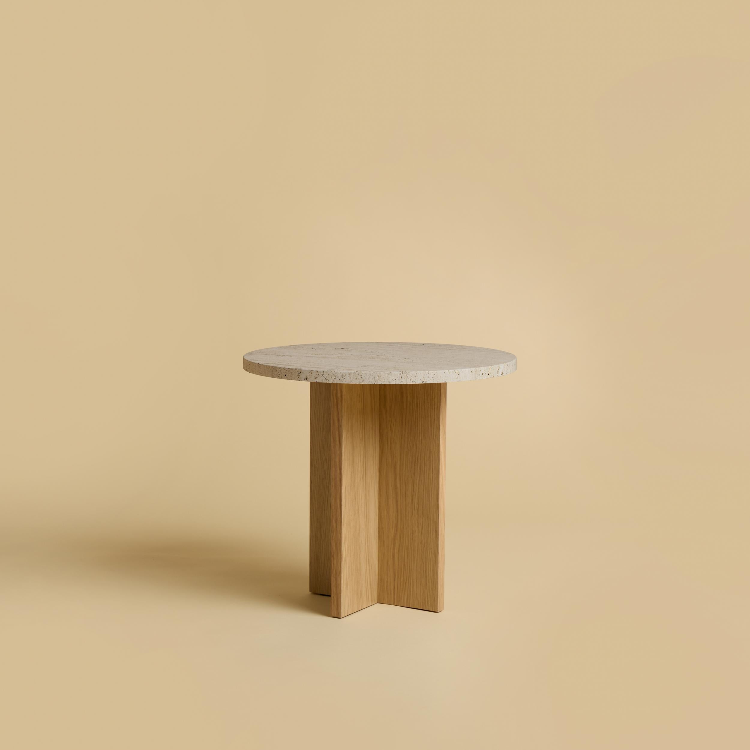 Roman Travertine and Oak Sherman Side Table by Lebanto
Dimensions: W 45 x D 45 x H 39 cm
Materials: Oak wood and marble.

Lebanto is an expression of identity, a tapestry of dreams woven from the threads of their lives. Their journey began with a
