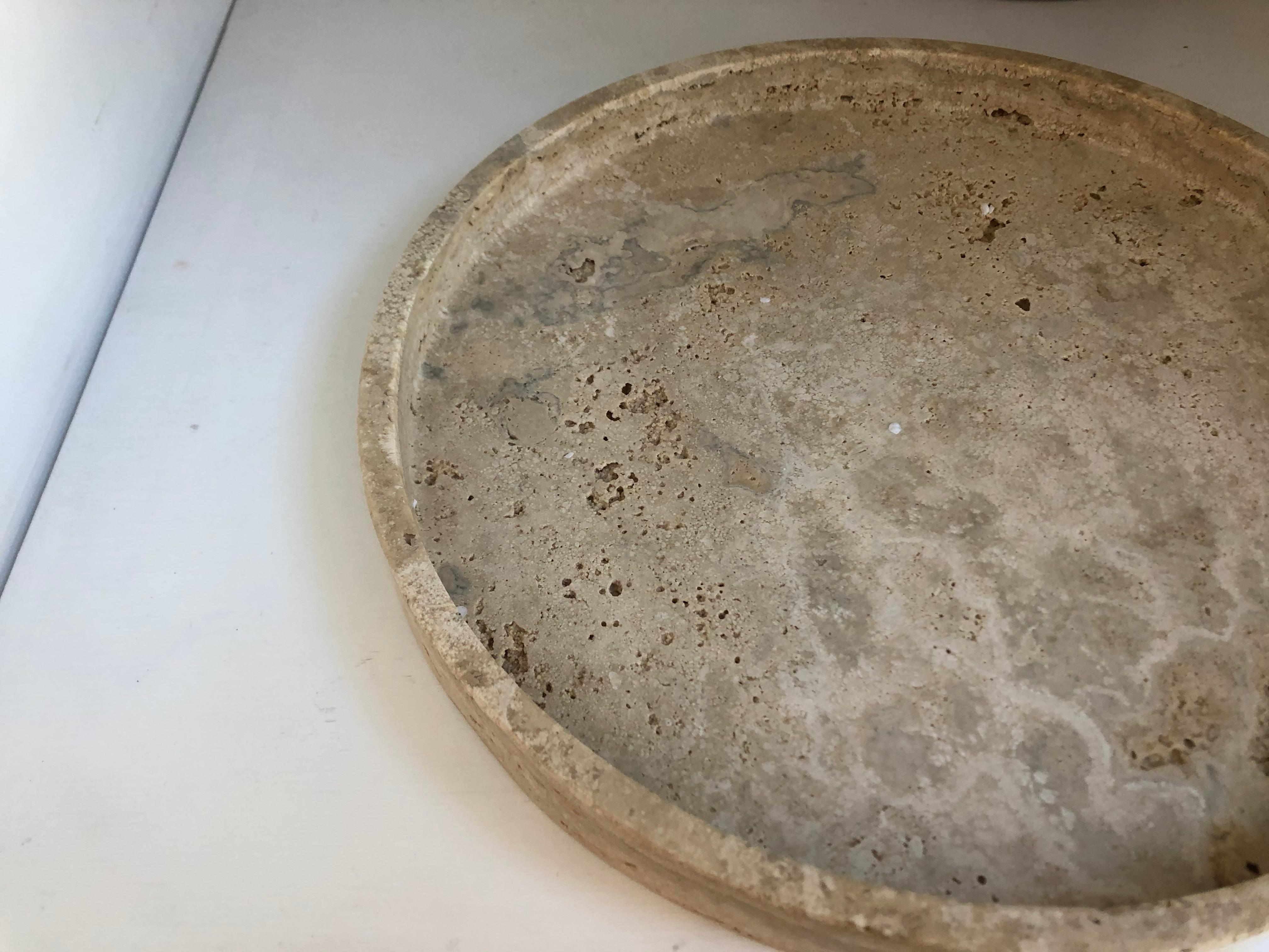 Roman round travertine tray by Le Lampade.
Made in Italy 
This item can be also custom made.
