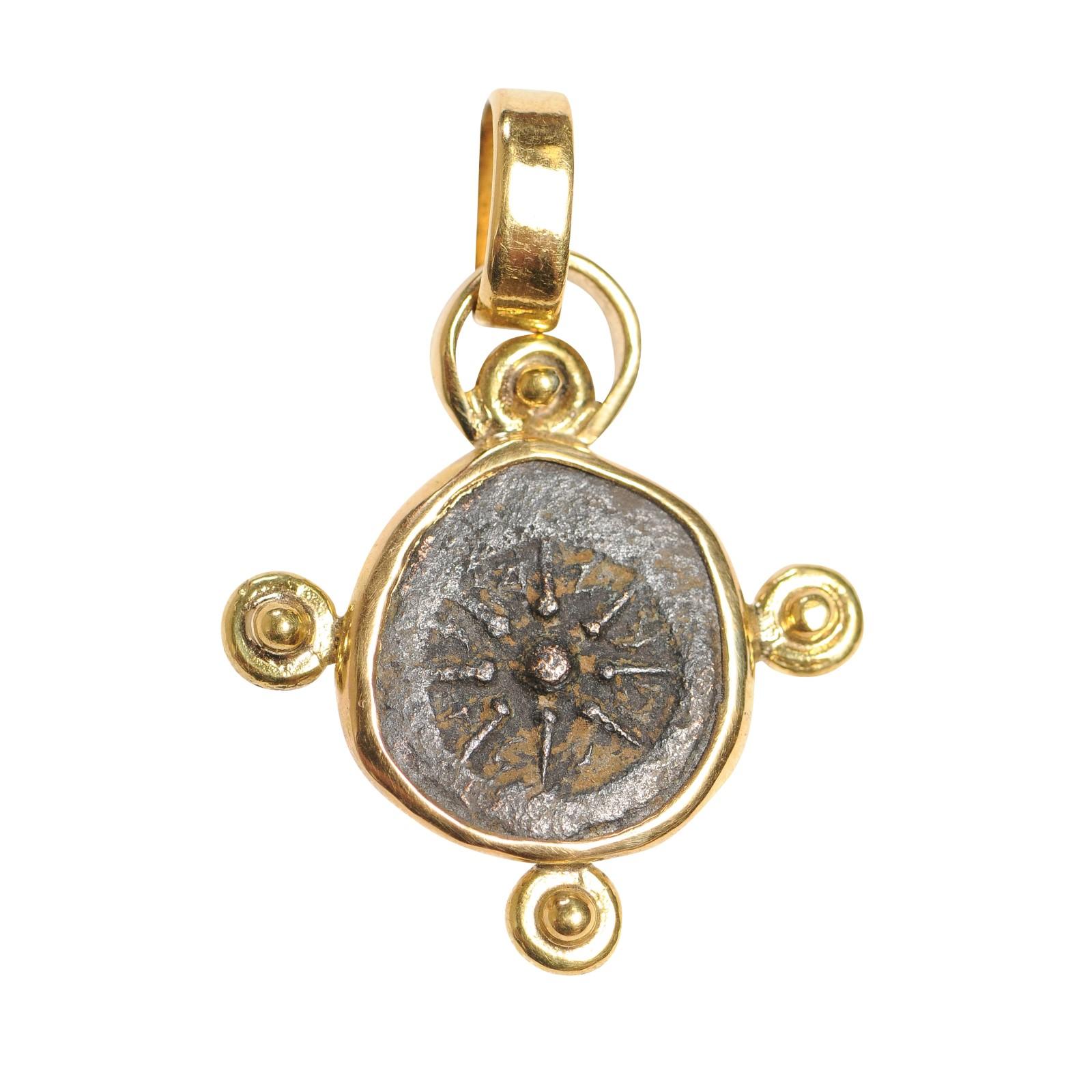 An Authentic Roman Bronze Widow's Mite Coin, Alexander Jannaeus, the Hasmonean King of Judaea (103 to 76 BC) Prutah to 200 AD, set in a custom 22k gold bezel with 22kt gold bail. Pendant measures approximately 15/16
