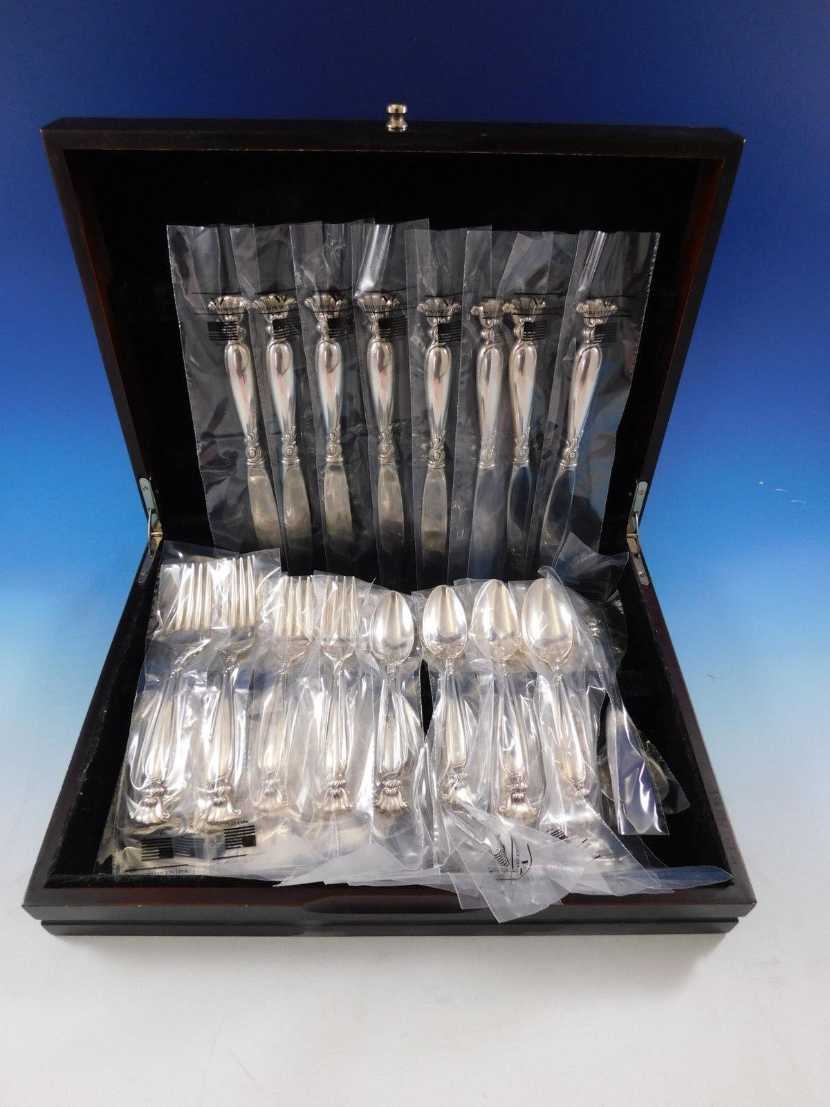 New, unused Romance of the sea by Wallace sterling silver flatware set, 42 pieces. This set includes:

8 knives, 9 1/8