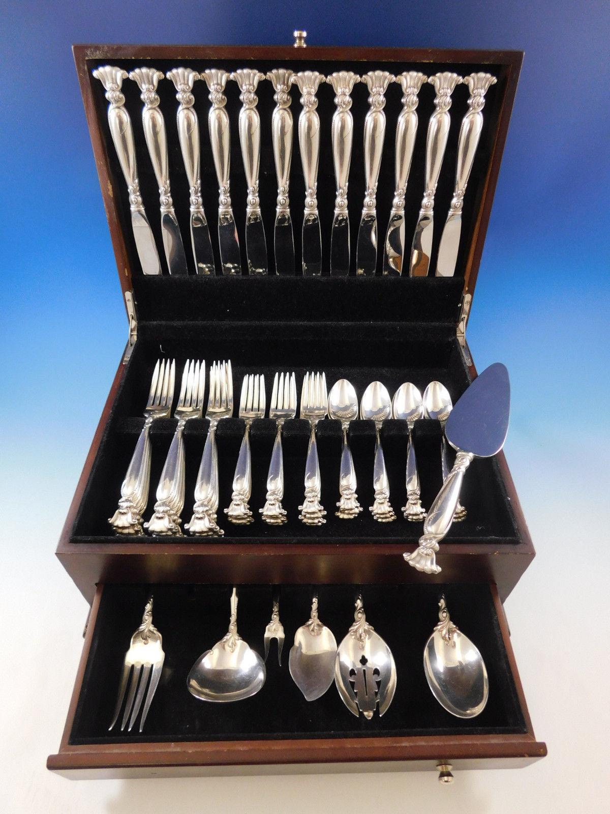 Exquisite dinner size romance of the sea by Wallace Sterling silver flatware set - 55 pieces. This set includes:

12 dinner size knives, 9 7/8