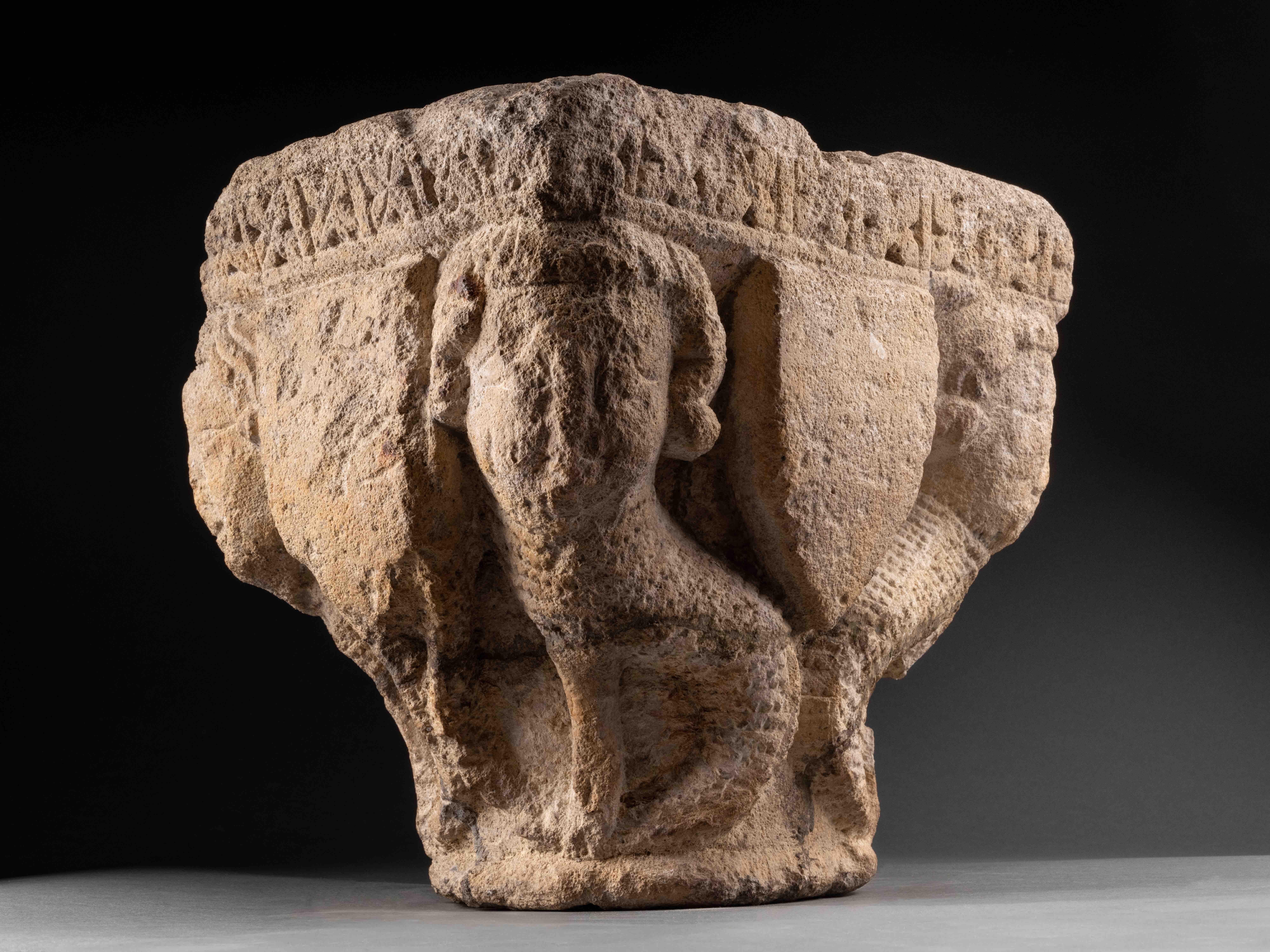Rare romanesque capital with sirens
France, XIII century
Limestone 
25 x 28 x 22 cm


This finely carved Romanesque capital, executed in high relief from limestone, features four hybrid figures resembling harpies (or sirens), positioned at the