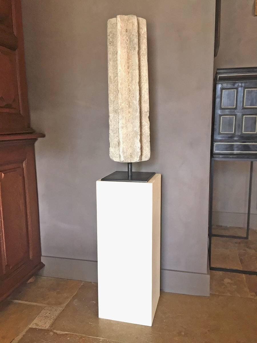 This Spanish grey sandstone column dates circa 12th-13th century. It most likely was an arch support in a cloister arcade. The peculiar shape has to been seen in the light of the centuries of Islamic influence in the Iberic world. This import of