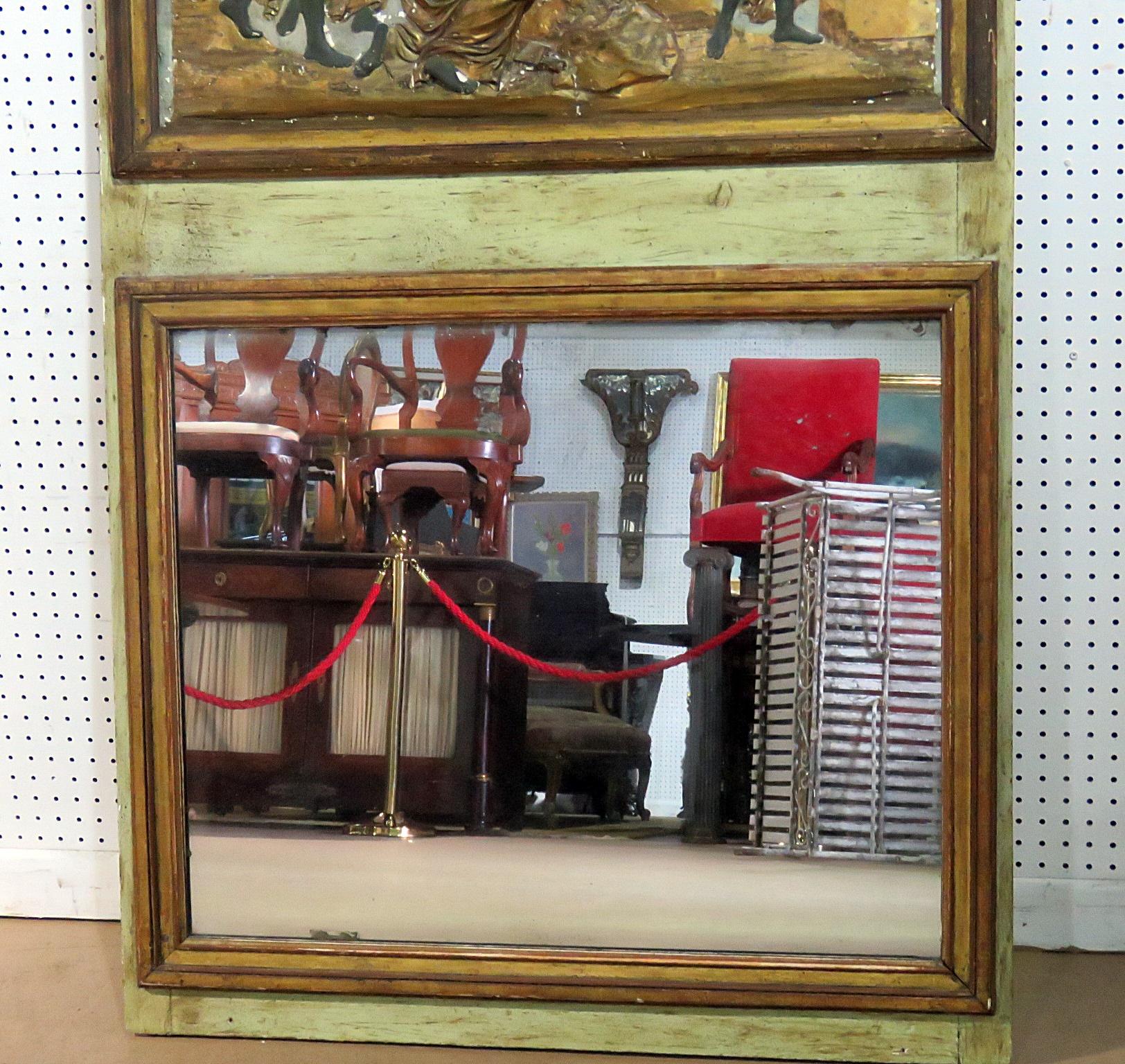 This is an antique mirror made around the turn of the last century and depicts what appears to be a plaster scene of painted Roman statues. The mirror is in its original condition and can be redone if neccessary but has character just the way it is. 