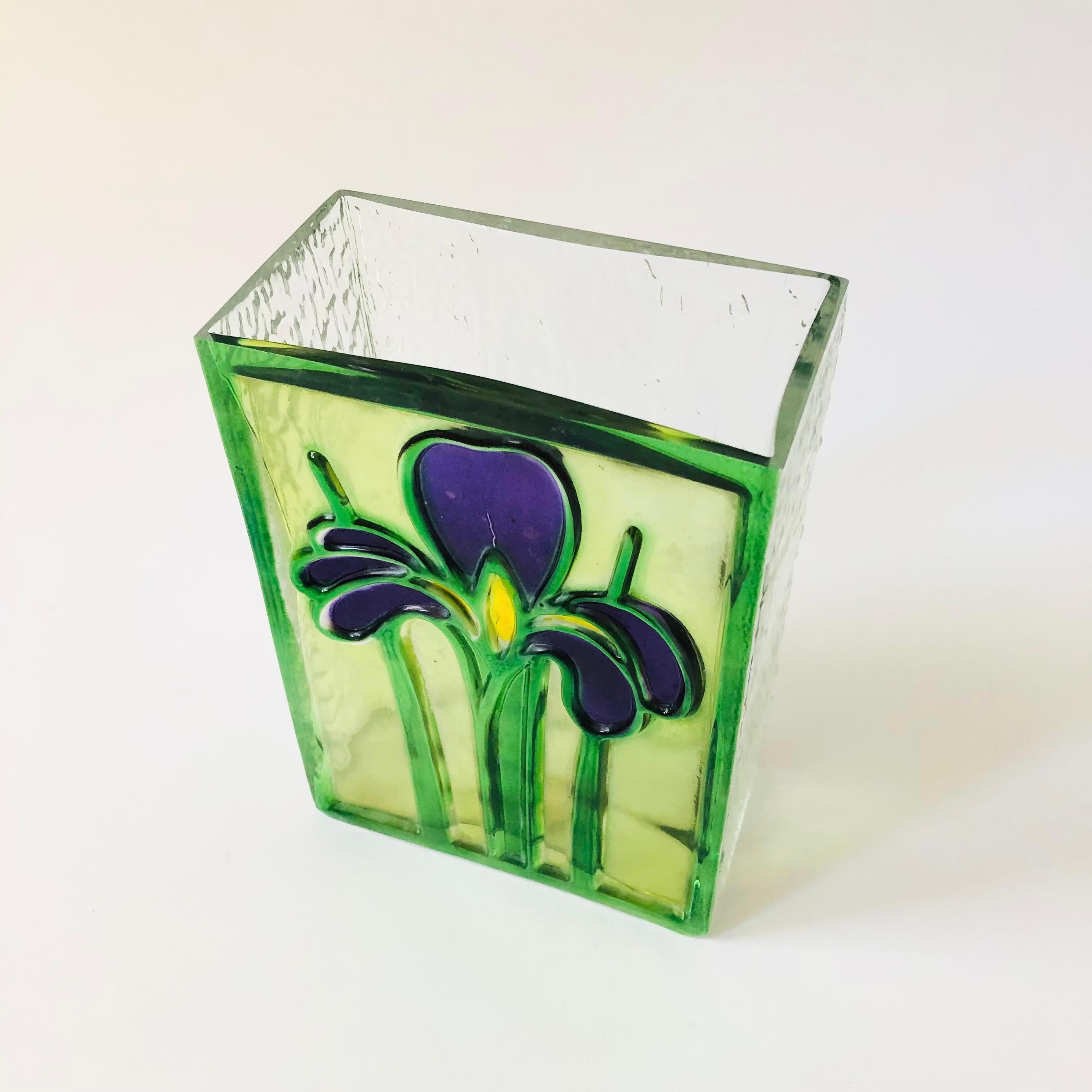 A wonderful vintage Romanian glass vase. Features textured glass an iris design on one side. Nice blocky shape. Original sticker still attached, made in 1985 by FDTA.

