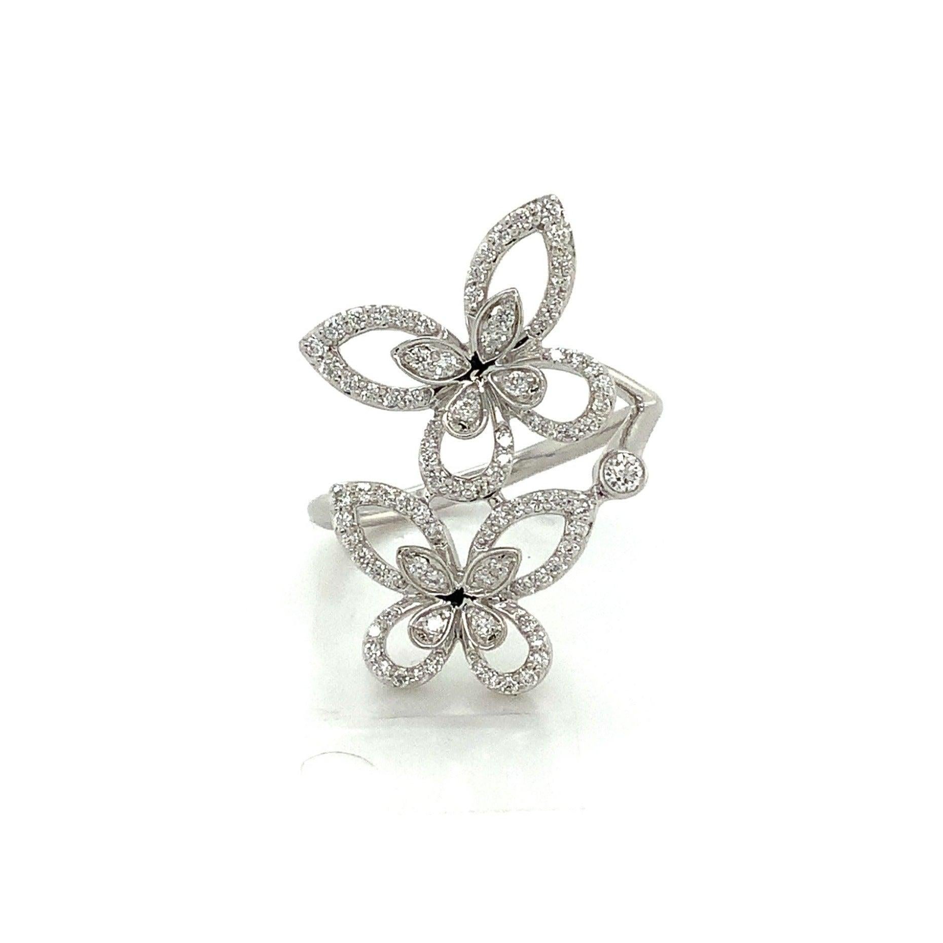 Enhance your jewelry collection with the stunning Roman+Jules 2 Butterfly Bypass Right Hand Diamond Ring. Crafted in 14K white gold, this elegant piece features 89 round brilliant cut diamonds with a total weight of 0.40 carat, boasting G color and