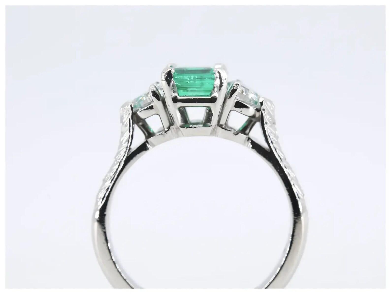 Romantic 1.42 CTW Emerald & Heart Shaped Diamond Three Stone Ring, Platinum In Excellent Condition For Sale In Boston, MA