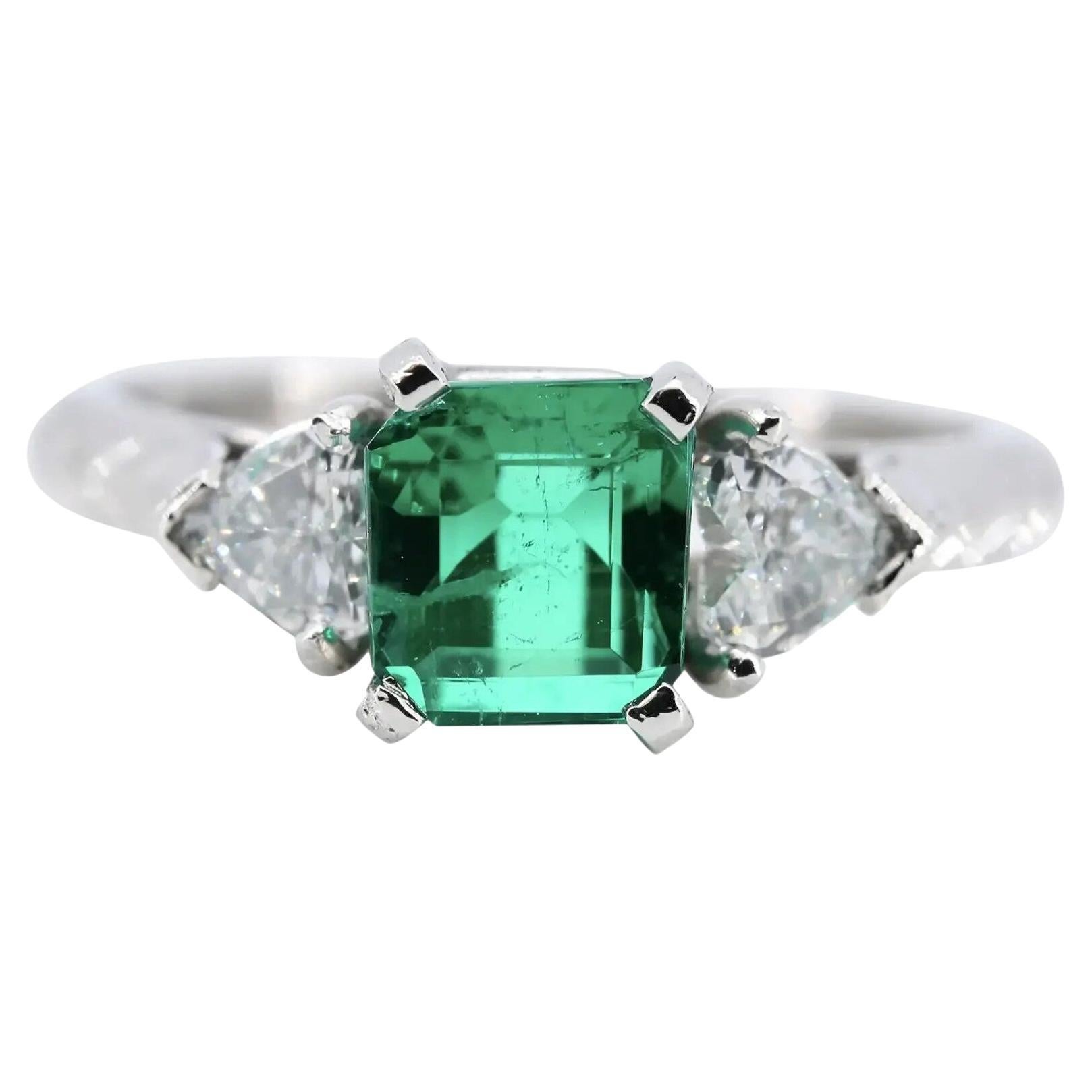 Romantic 1.42 CTW Emerald & Heart Shaped Diamond Three Stone Ring, Platinum