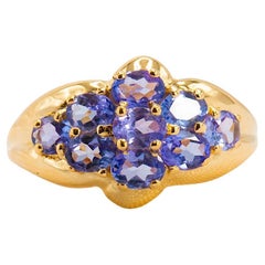 Anillo romántico de racimo de tanzanita oval de 2 quilates en oro amarillo de 14 quilates