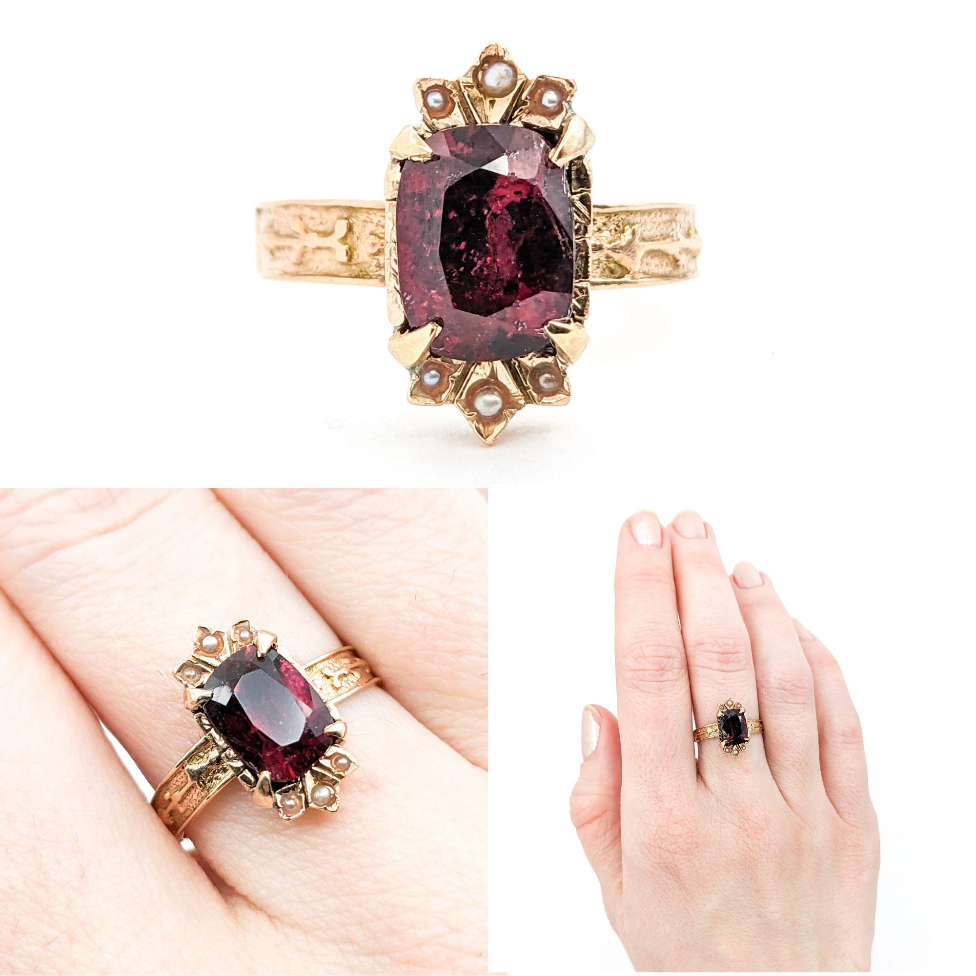 Romantic Antique Rubellite Tourmaline & Seed Pearl Ring in Yellow Gold

Introducing this beautiful antique ring, exquisitely crafted in 14k yellow gold. This unique piece showcases a striking 1.69ct cushion cut Rubellite Tourmaline centerpiece,