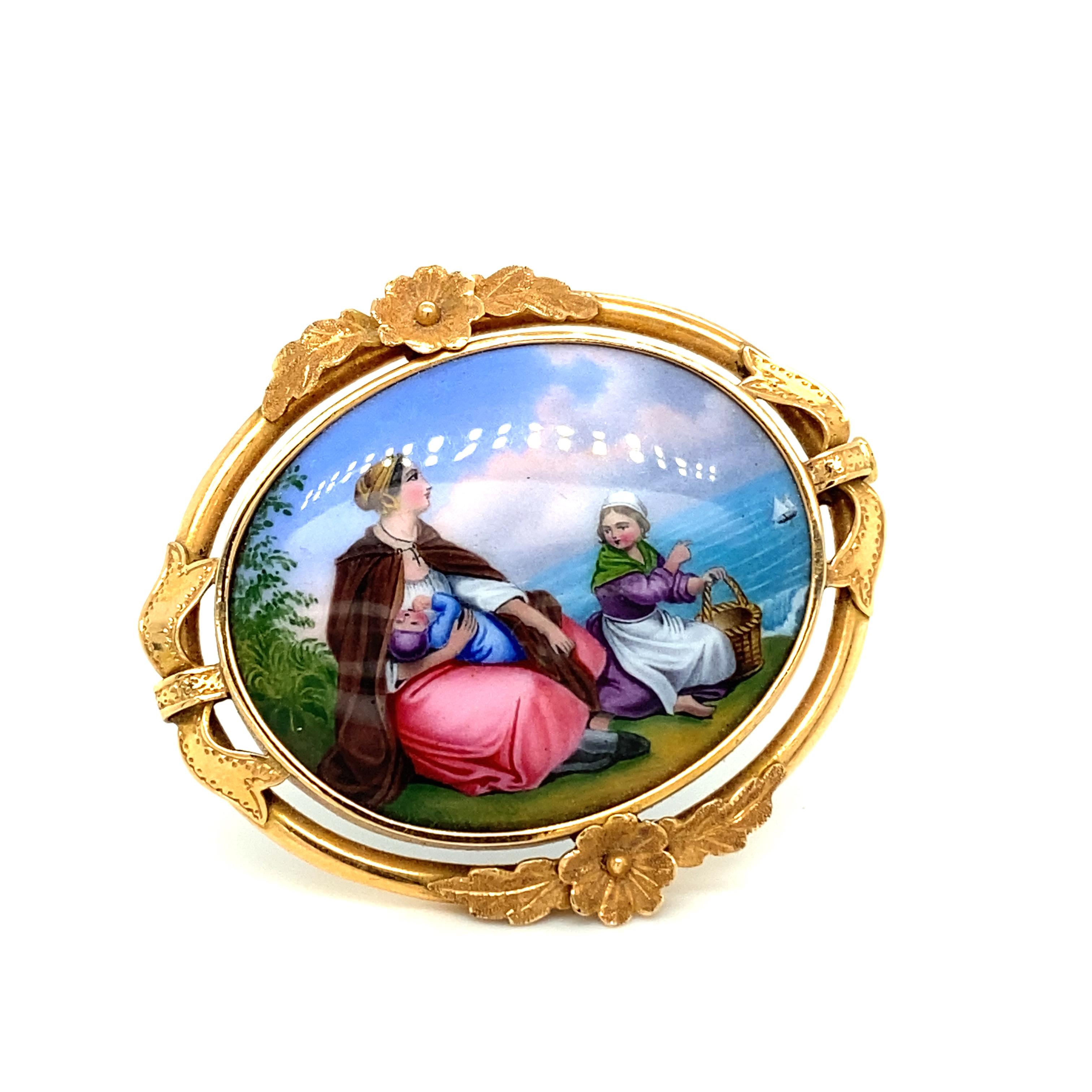 At the centre of this romantic brooch in 18 karat rose gold is a wonderfully composed scene painted in delicate enamel colours. A woman sits on a rocky cliff with her baby pressed to her chest and a little girl, looking down at a sailing ship