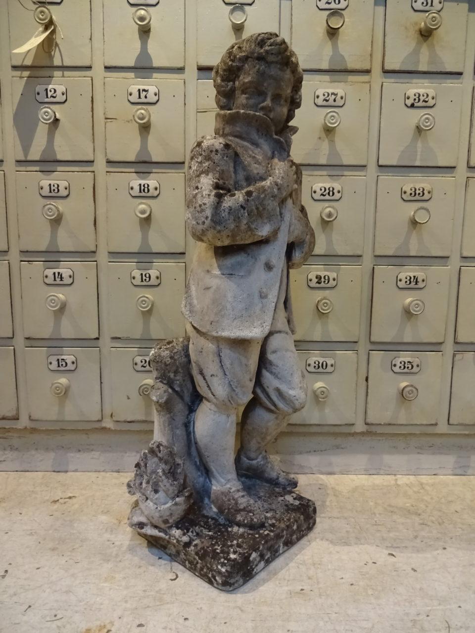 Romantic vintage French garden sandstone figure, from the South of France. Depicts a little boy hunched up and protecting himself from the rain. Lovely weathered patina from the elements.