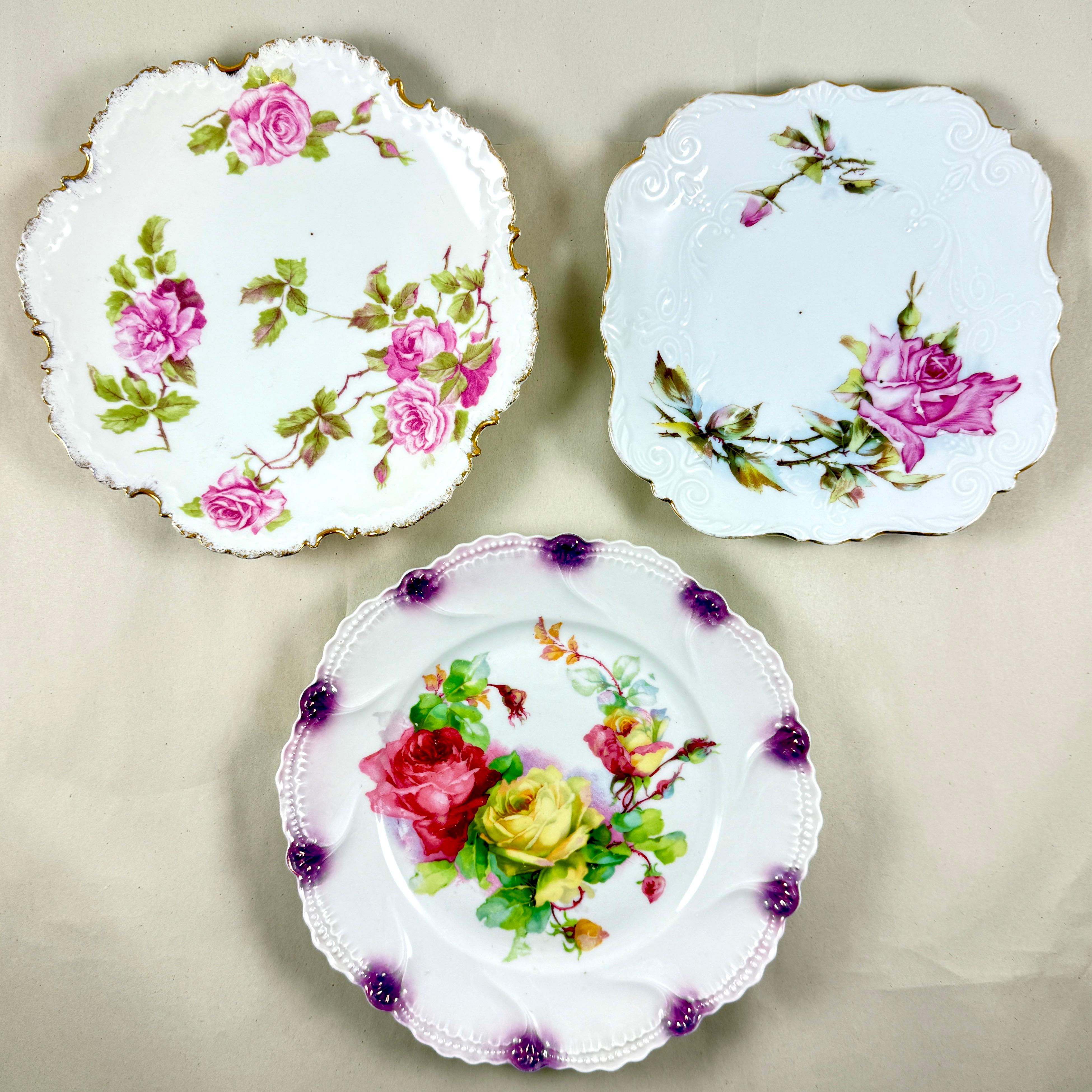 A set of three German and Bavarian porcelain rose plates, circa 1890-1910.

These plates are wonderful in a romantic decor, either hung on the wall or placed on side tables.

The square plate is marked Germany - measuring 7 inches across x 1 inch