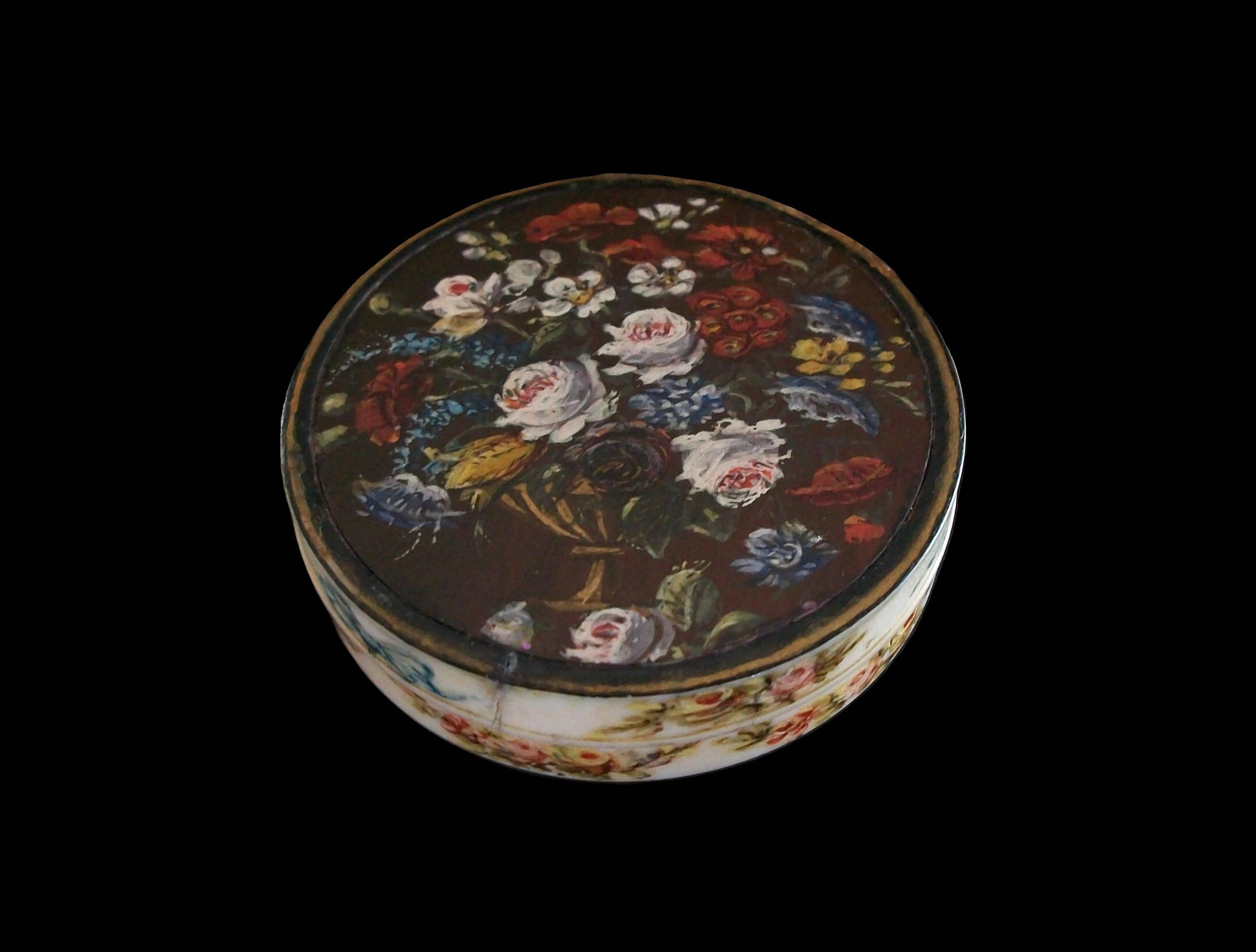Romantic hand painted Dieppe bovine bone floral snuff box - featuring a colorful display of flowers set against a solid brown background - the sides decorated with garlands and blue ribbons - unsigned - France - early 19th century.

Excellent