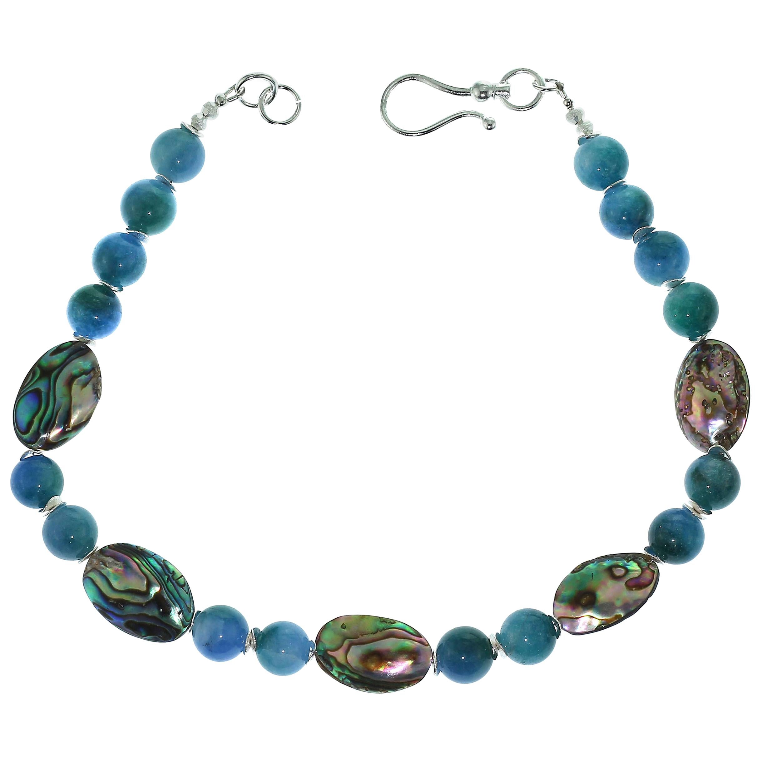 Gift from the Sea, Paua Shell in all its iridescent colors and agate of the same base teal colors. These puffed Paua Shell flash shades of green, blue, purple, and, and aqua, each is its own unique shape, but all are approximately 27 x 18 MM. The