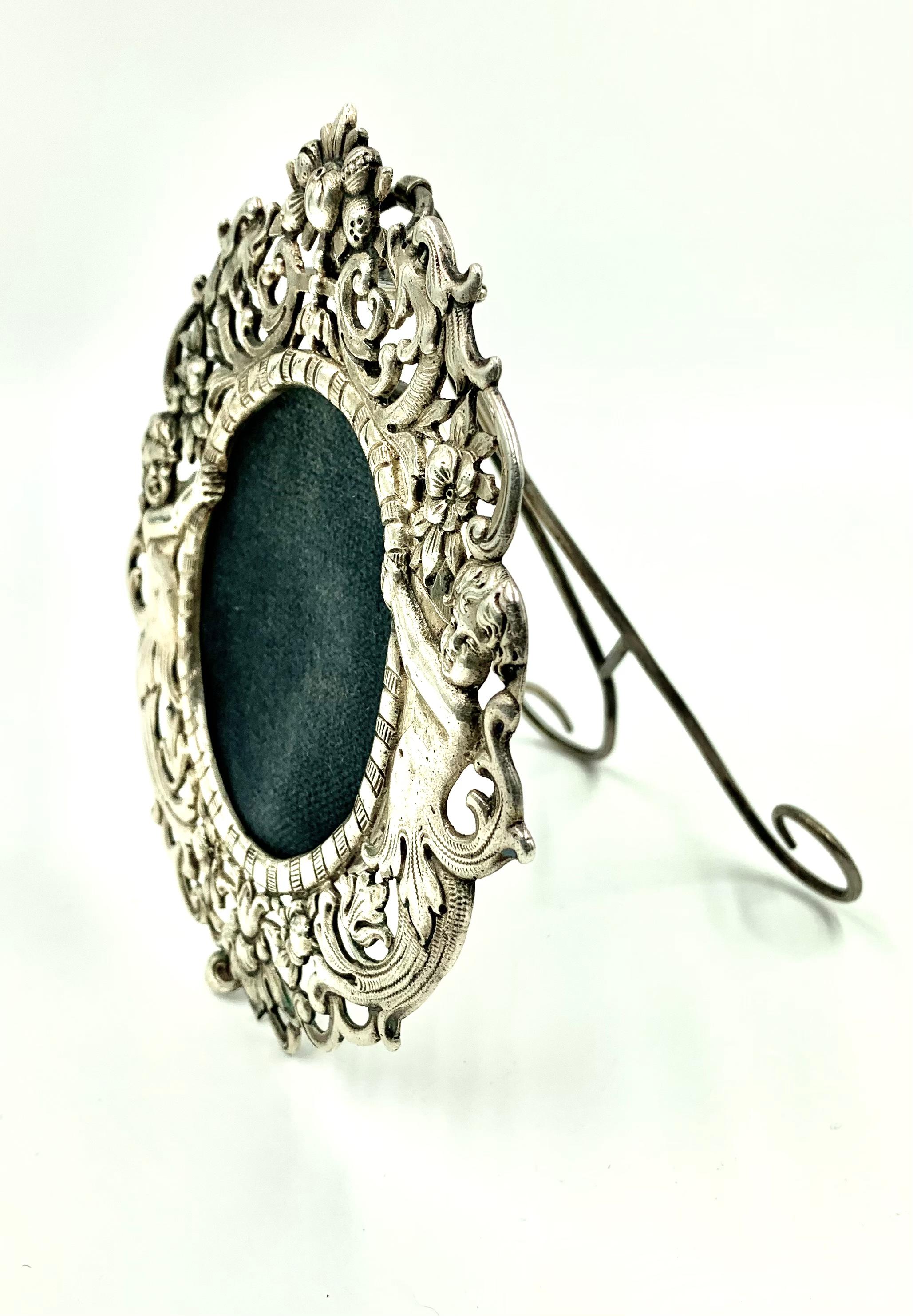 European Romantic Ornate Oval Silver Picture Frame, Angels with Floral Garlands For Sale