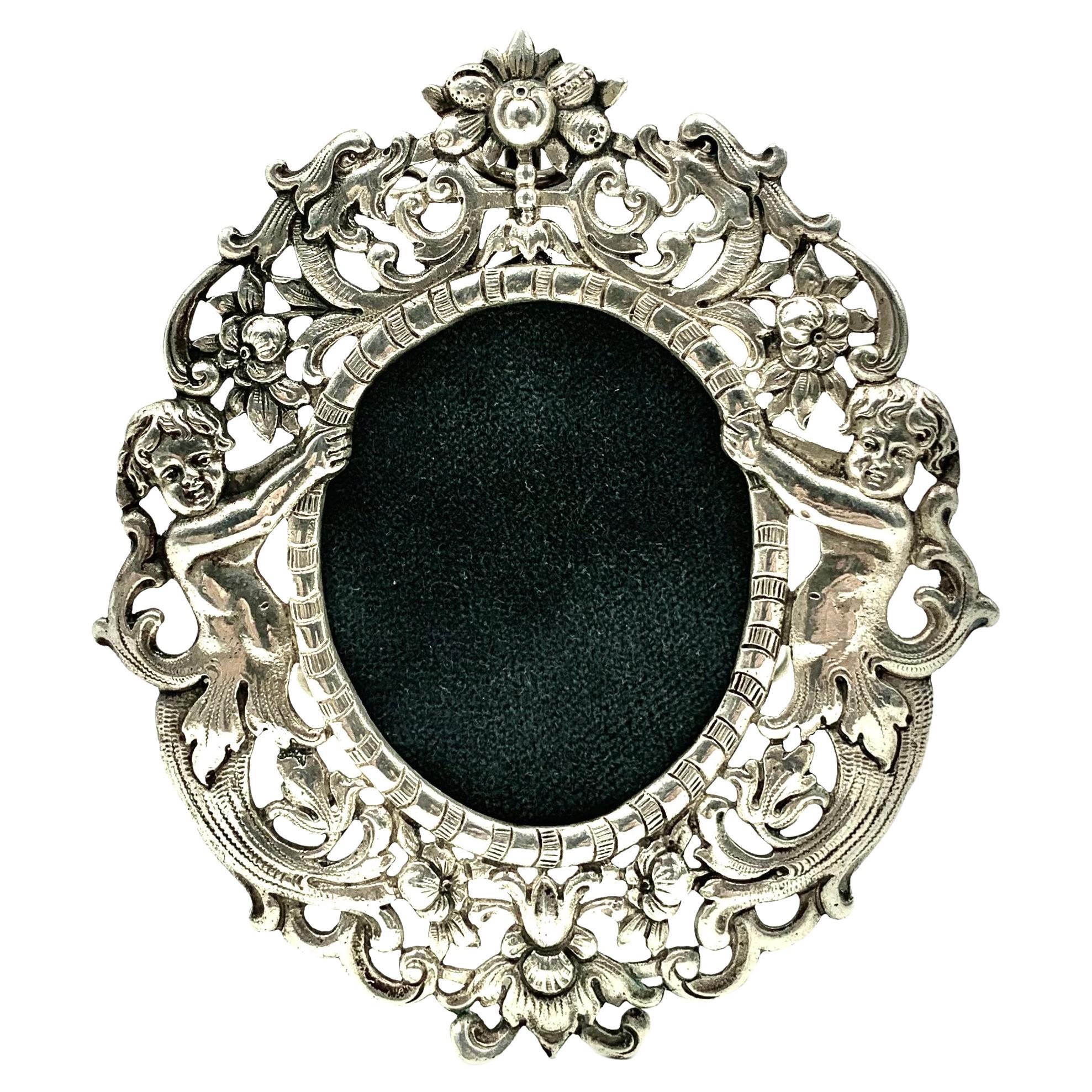 Romantic Ornate Oval Silver Picture Frame, Angels with Floral Garlands For Sale