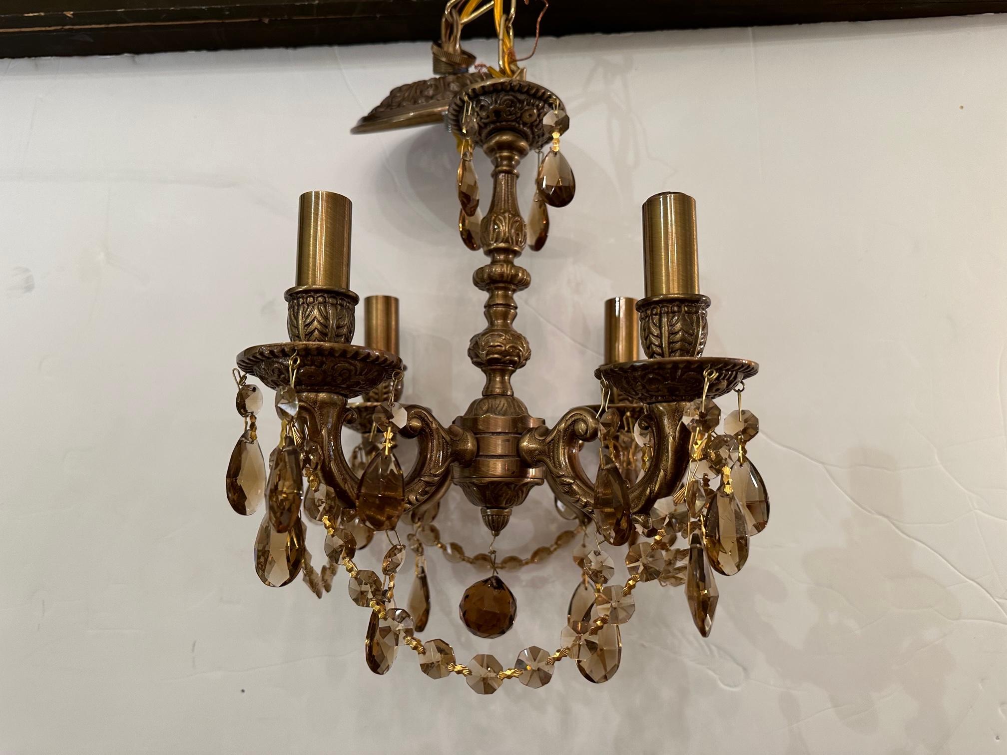 Lovely small brass vintage 4 arm chandelier with lovely amber crystals.
8 
