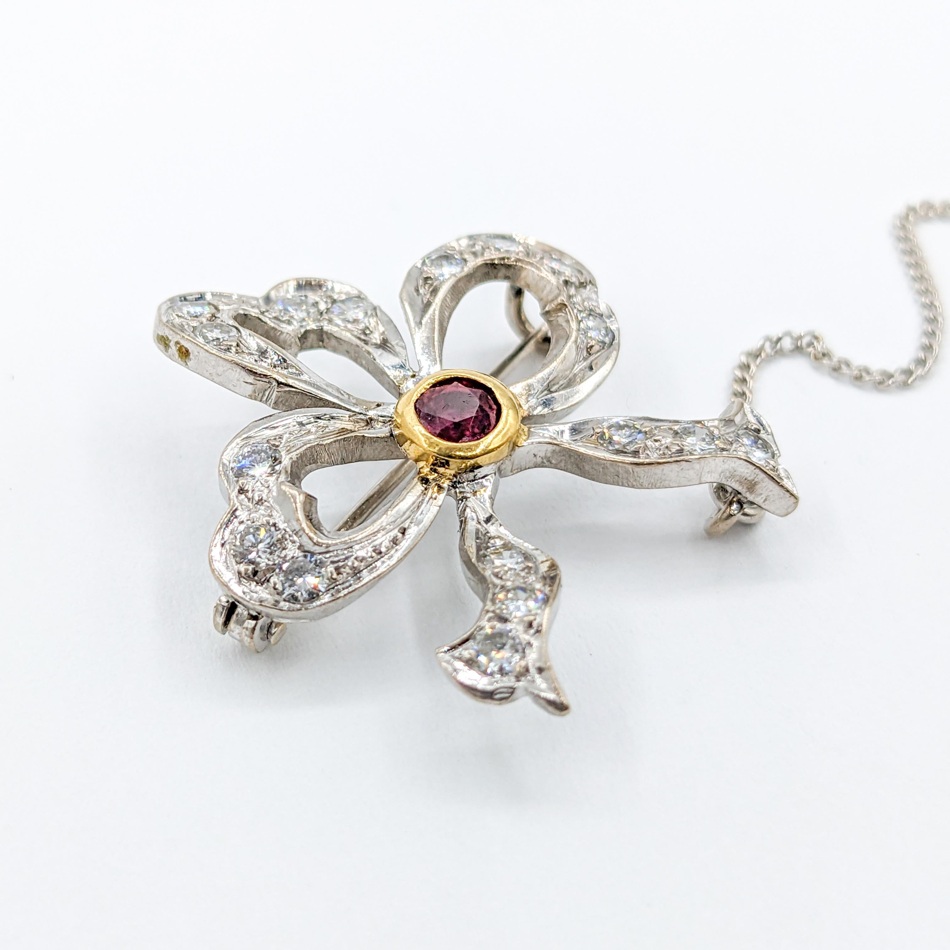 Platinum Ribbon Diamond & Ruby Brooch: A Timeless Expression of Romance

Unveil an era of classic allure with our romantic Platinum Ribbon Brooch. This vintage piece is meticulously crafted in radiant platinum with .50ctw round diamonds, each