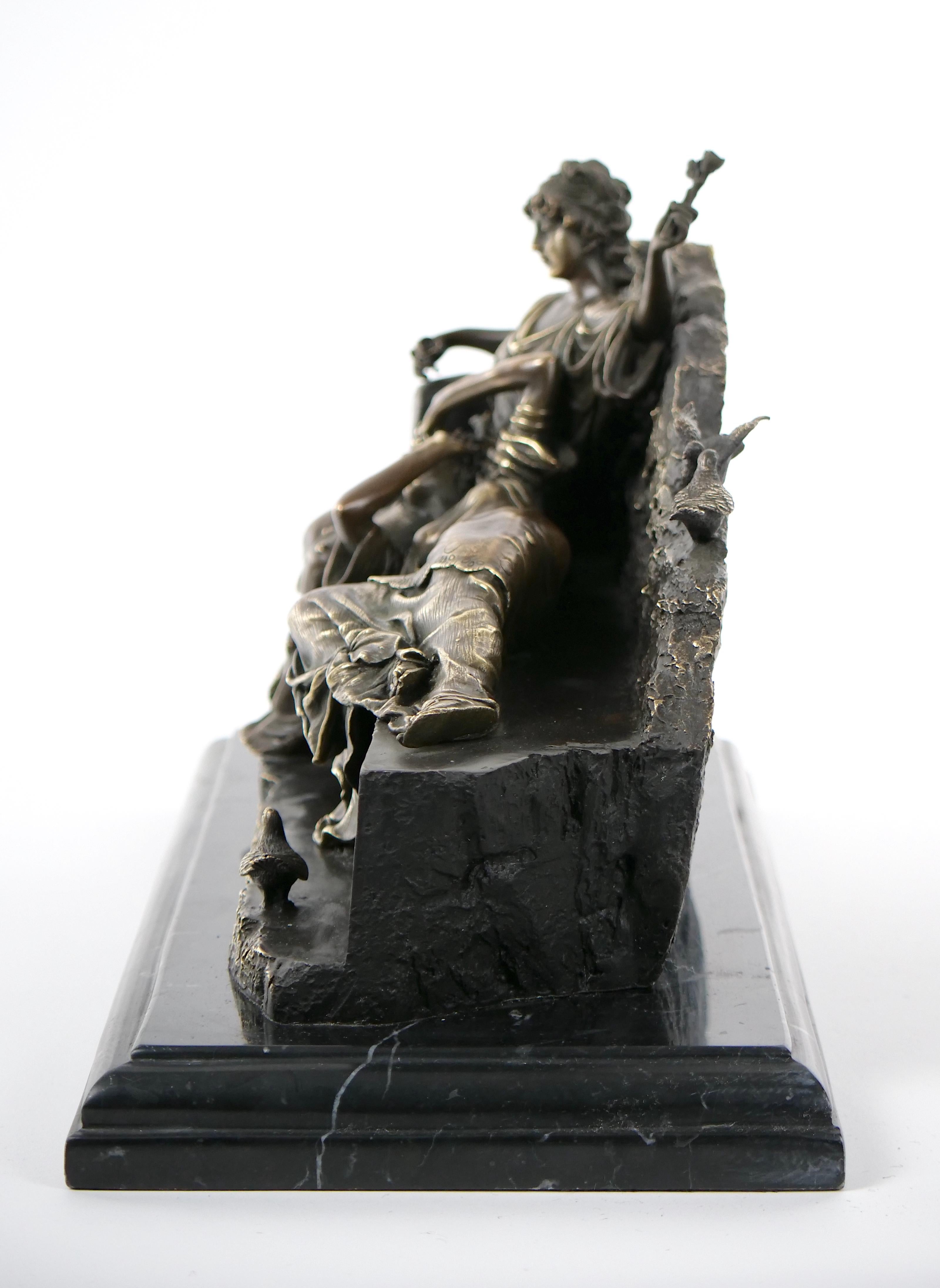 
Indulge in the captivating allure of our romantic reclining gilt-patinated bronze sculpture by the renowned artist Miguel Fernando Lopez, also know as Milo. This exquisite piece showcases the artistry of maidens figures in a display of timeless