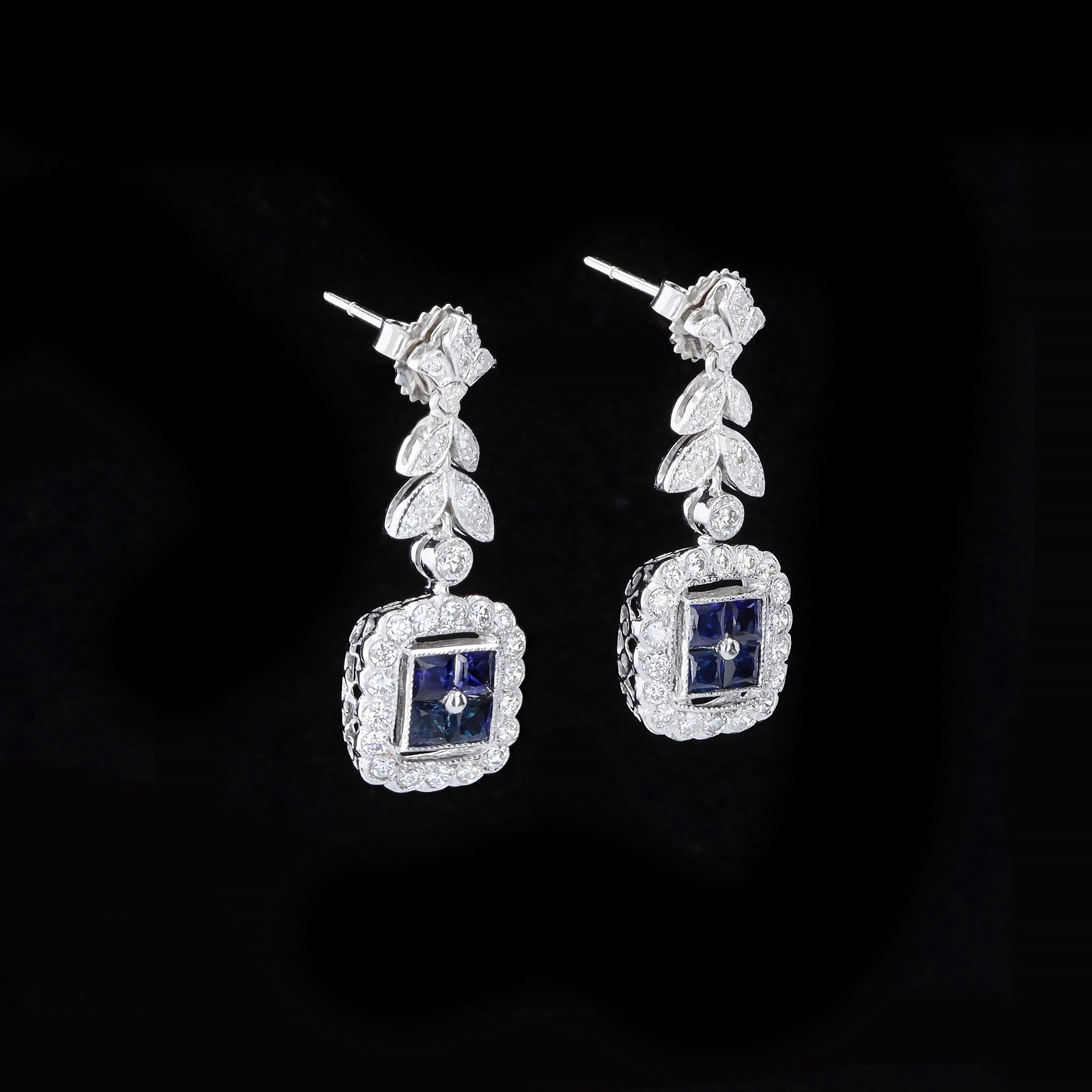 Timeless treasures that provide an eye-catching pop of color. These 18K white gold earrings feature square cut sapphires that weigh approximately 1.00ct. The eight sapphires are accentuated by 62 round cut diamonds that weigh approximately 0.90ct.
