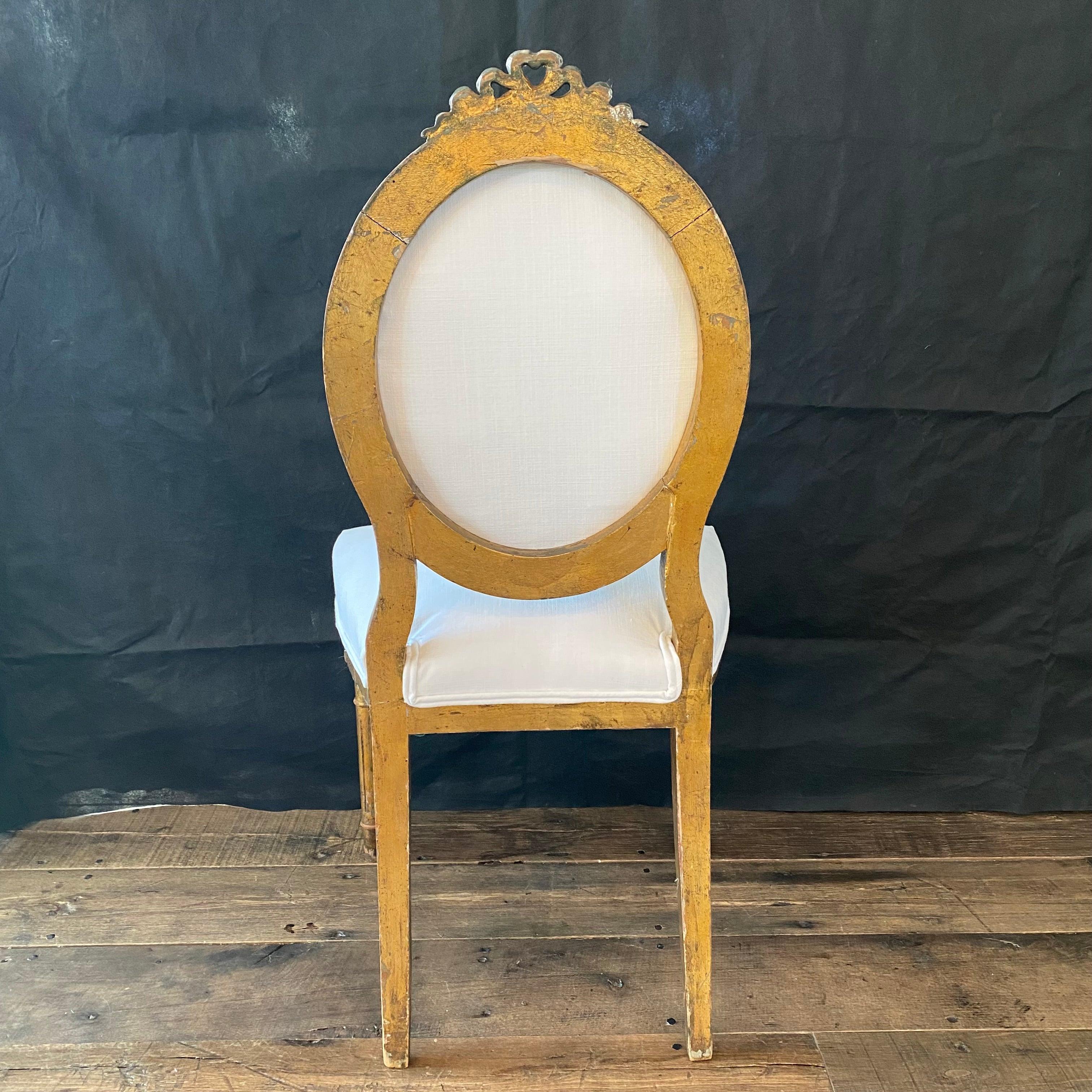 Stunning and romantic set of four antique French Neoclassical Louis XV chairs in original gold gilt paint, newly reupholstered in high quality French ivory linen blend. #5798