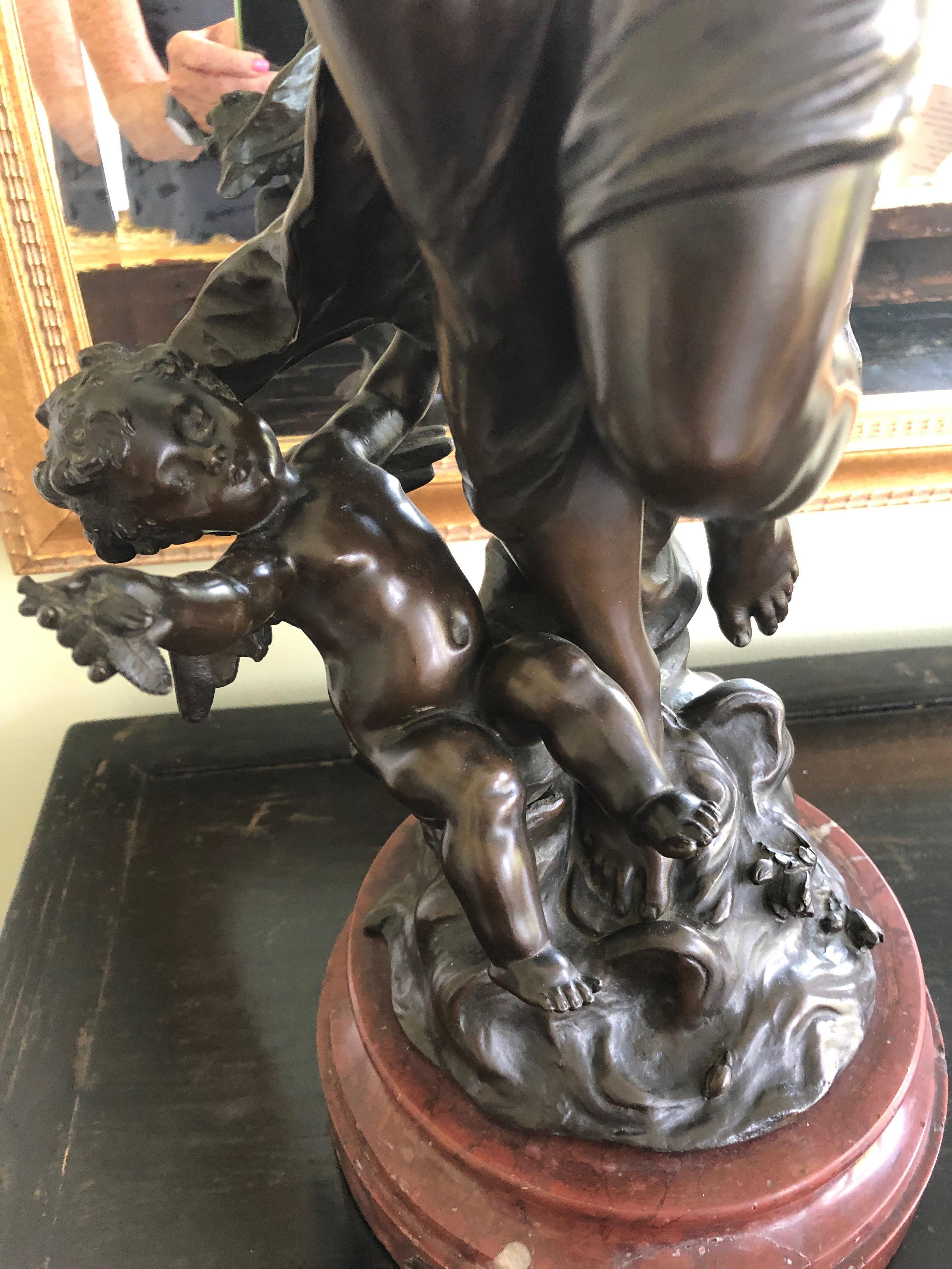 A gorgeous very fine 19th century heavy bronze statue in a dramatic pose having a cherub by her feet and a rouge marble base. Title is Crepuscule or Twilight by Hippolyte Francois Moreau , circa 1865. The sculptor has many of his pieces in the