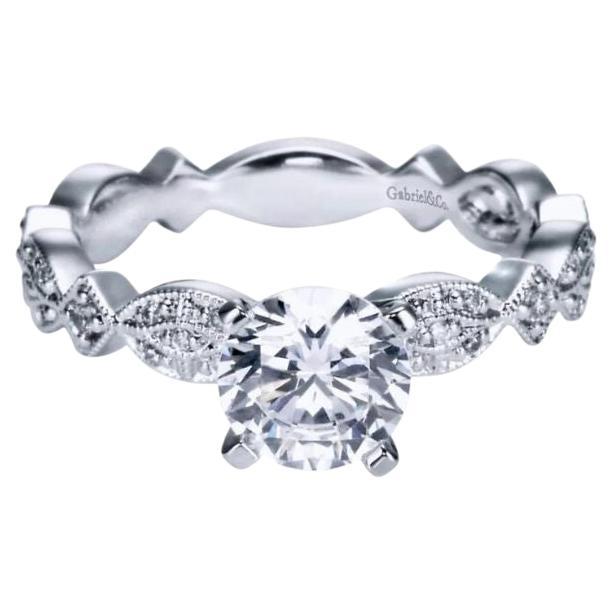 Ladies' 14k White Gold Diamond Engagement Mounting﻿. Romantic scalloped design combined with delicate pave diamonds and exquisite milgrain give this unique ring a playful enigmatic look. Part of Gabriel and Co Engaged collection. Center diamond NOT