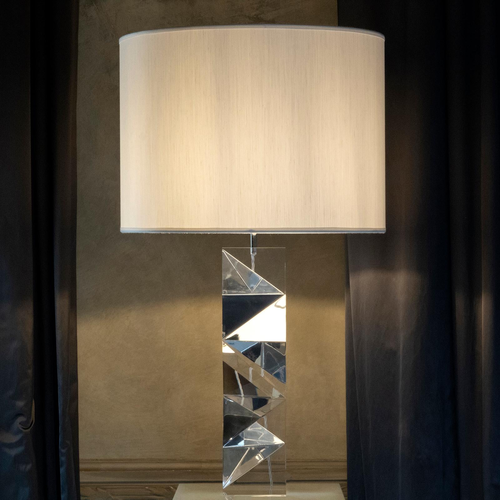 Sculptural faceted clear plexiglass table lamp part of the Flair edition collection, chrome details, clear shantung lampshade, lamp measure cm13 x 13 x H. 60, shade cm 50 x H. 40, total high cm 96.