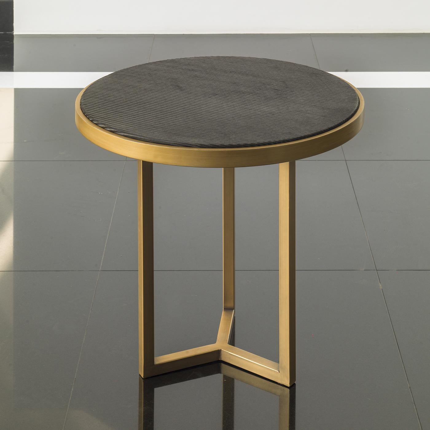Complete a chic vibe in a contemporary lounge area or living room with the Romeo black and gold side table. Designed by Chiara Provasi, the round side table stands on a glistening gold base and features a simple black top in lacquered wood. Thanks