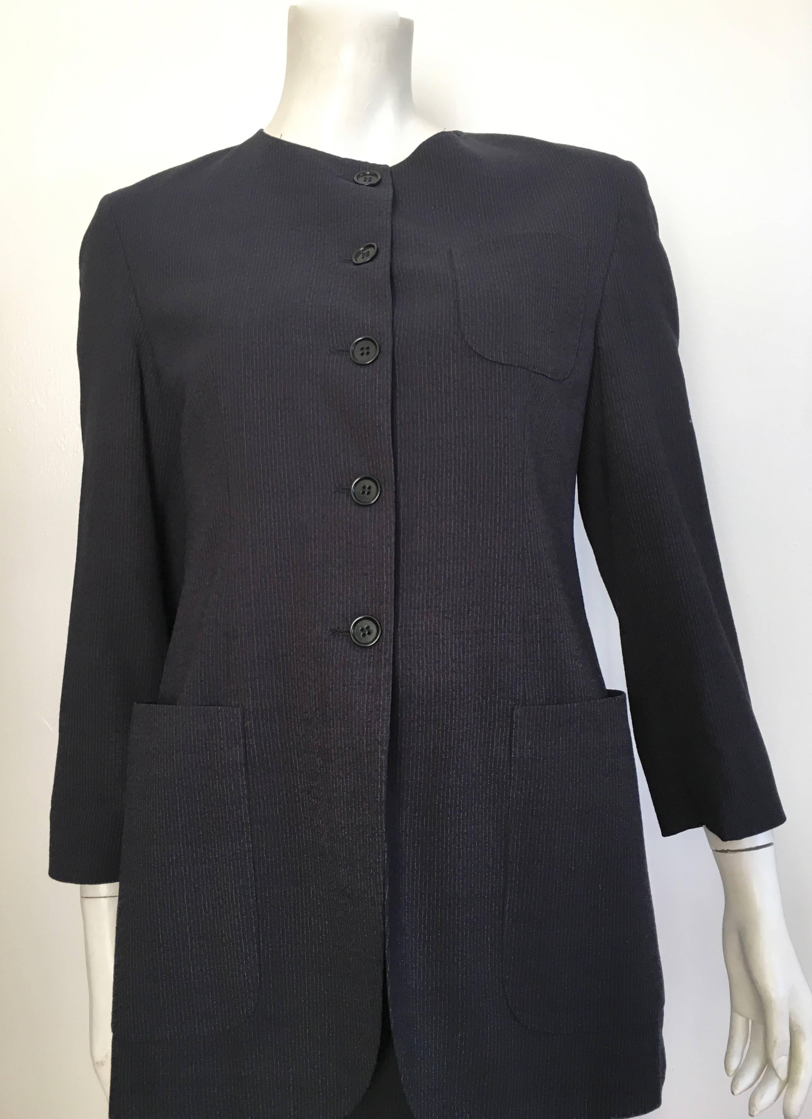 Romeo Gigli 1980s wool navy pinstripe button up jacket with pockets and wrap skirt will fit a size 6.  The jacket is labeled an Italian size 42 and the wrap skirt is labeled an Italian size 40. The waist on wrap skirt is 29. 1/4