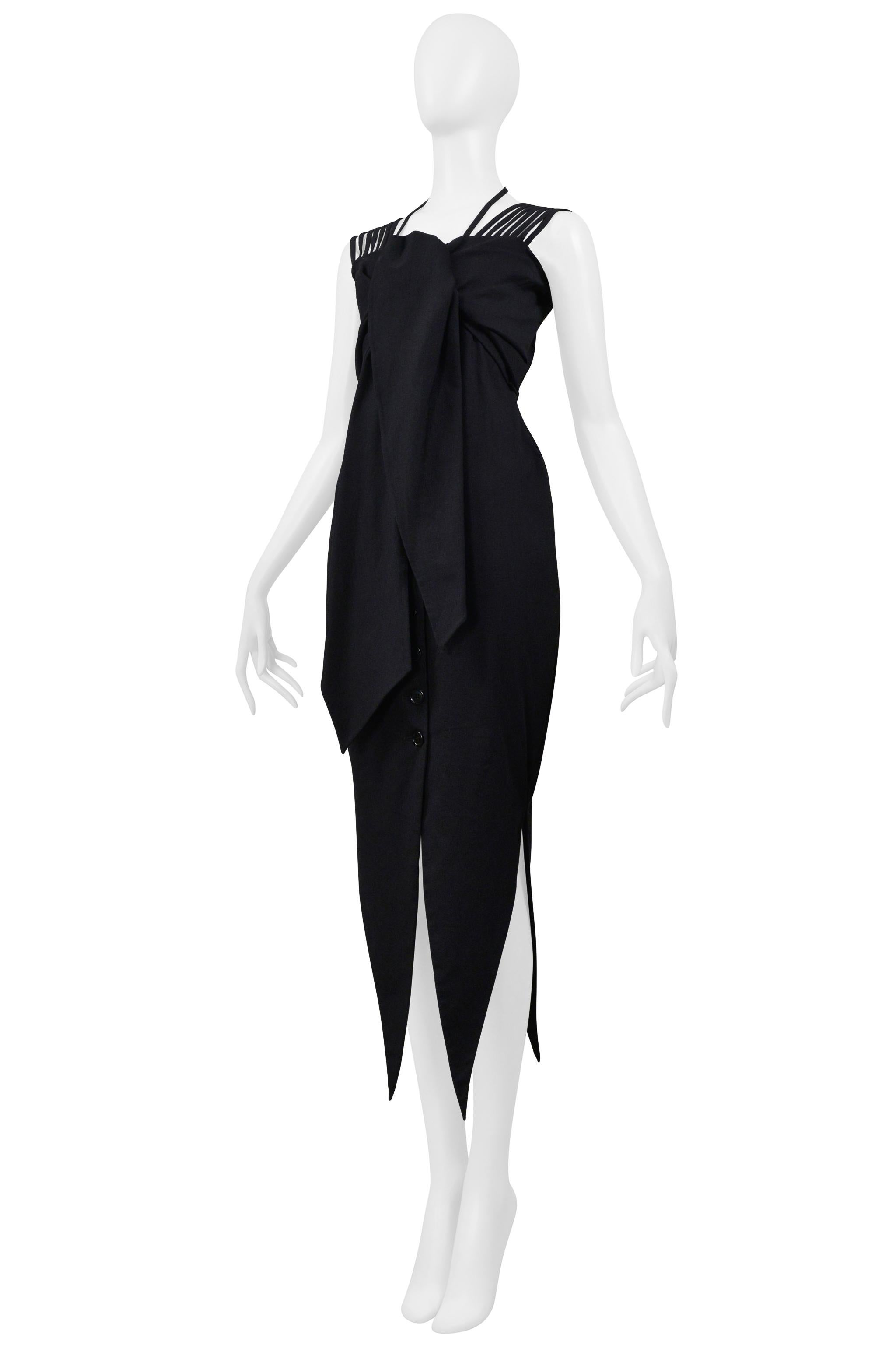 Resurrection Vintage is excited to offer a vintage Romeo Gigli black cold shoulder dress with stretch featuring a button front closure, an attached scarf at the bust, multiple shoulder straps and neck strap, a tailored waistline, and pointed