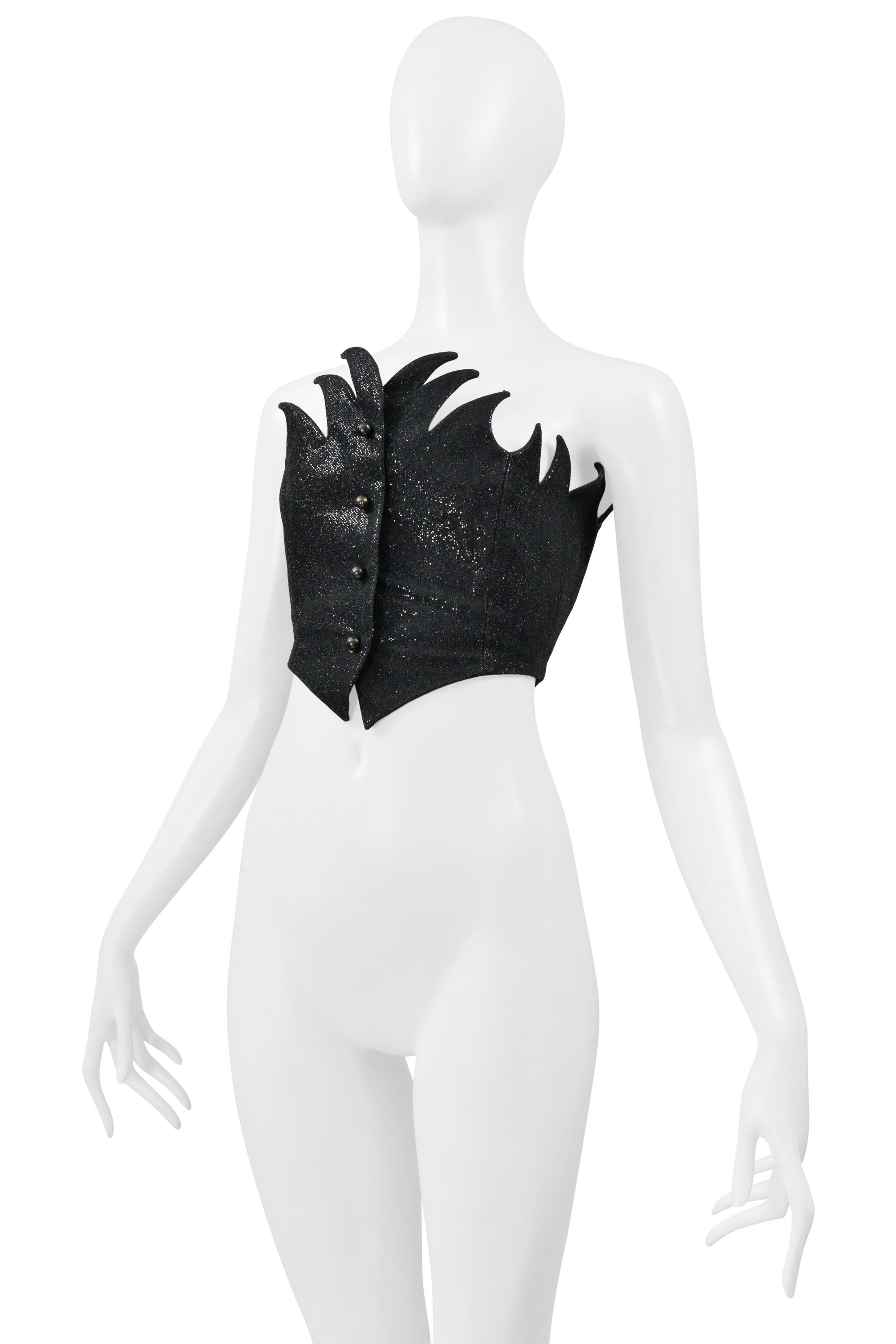 Resurrection Vintage is excited to offer a vintage Romeo Gigli black metallic flame bustier with button front closure and satin interior lining.

Romeo Gigli
Size 42 (No Size Label)
Fabric: 31% Nylon, 29% Acetate, 25% Cotton, 15% Polyester
1992