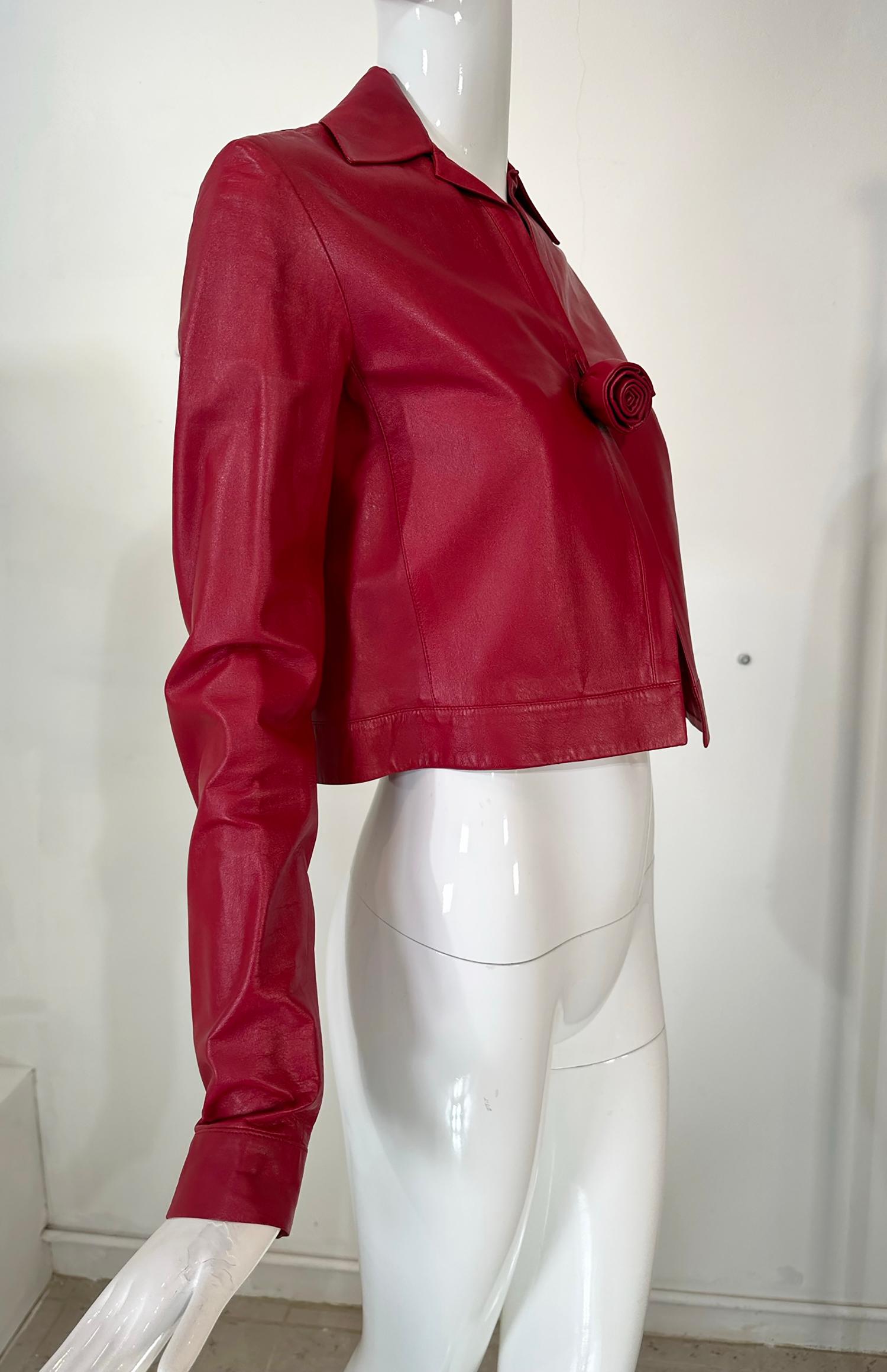 Romeo Gigli buttery soft garnet leather spencer style jacket with rose button front. A modern version of a Georgian fashion favourite, the Spencer jacket, the style is cropped with a single crafted leather rose button at the bust center front. Wing