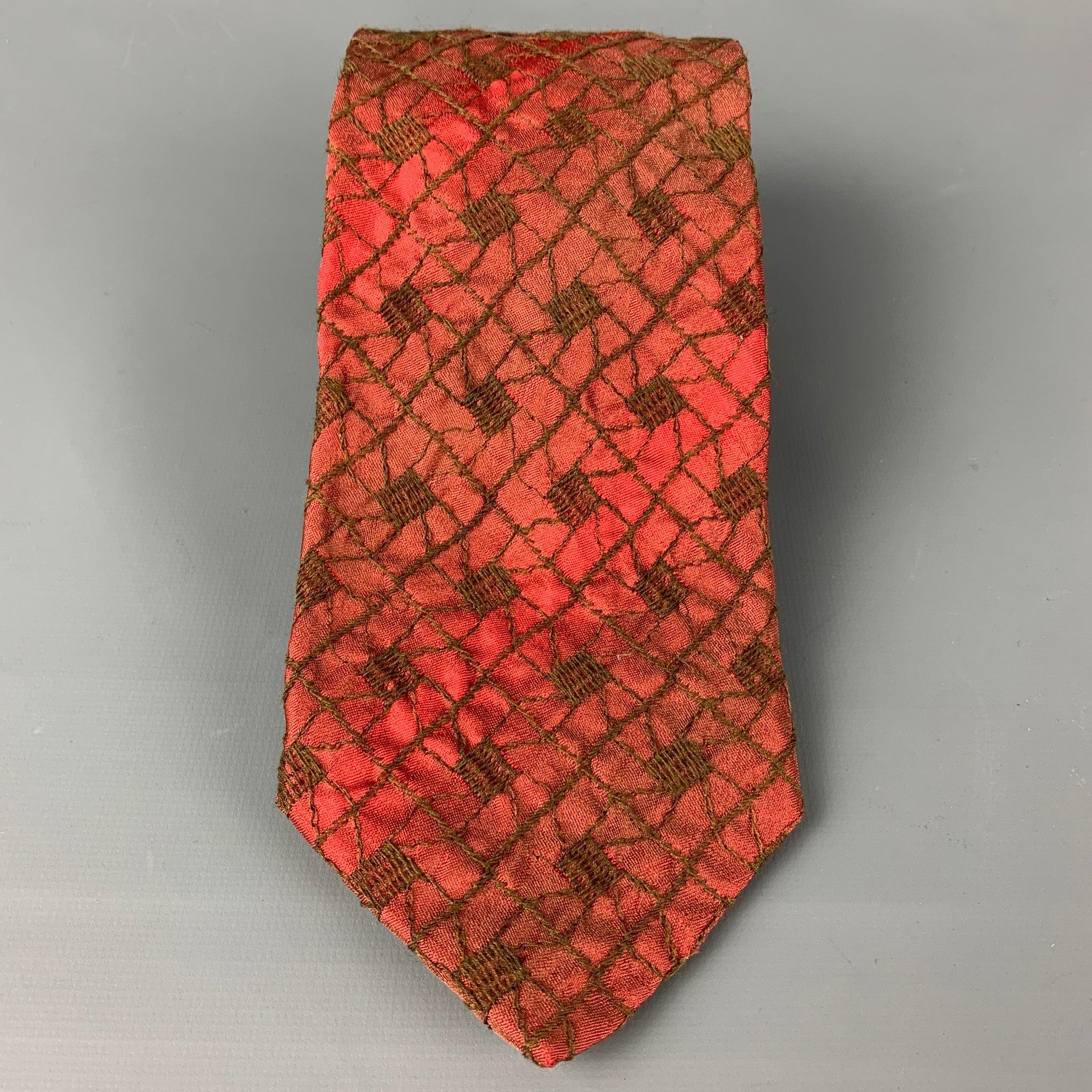 ROMEO GIGLI
 necktie comes in a red & brown silk with a all over embroidered print. Made in Italy. Very Good Pre-Owned Condition.Width: 3.75 inches 
  
  
  
 Sui Generis Reference: 118027
 Category: Tie
 More Details
  
 Brand: ROMEO GIGLI
 Color: