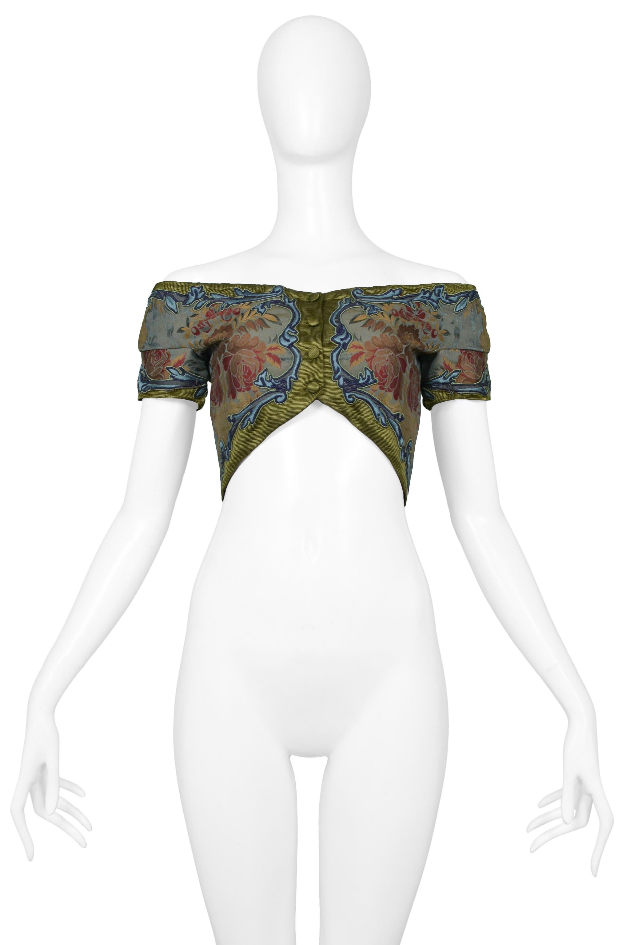 Resurrection Vintage is excited to present a vintage Romeo Gigli silk bustier featuring front button closures, floral patterns, and beautiful embroidery.

Romeo Gigli
Size: 42
Silk
Excellent Vintage Condition 
Authenticity Guaranteed 