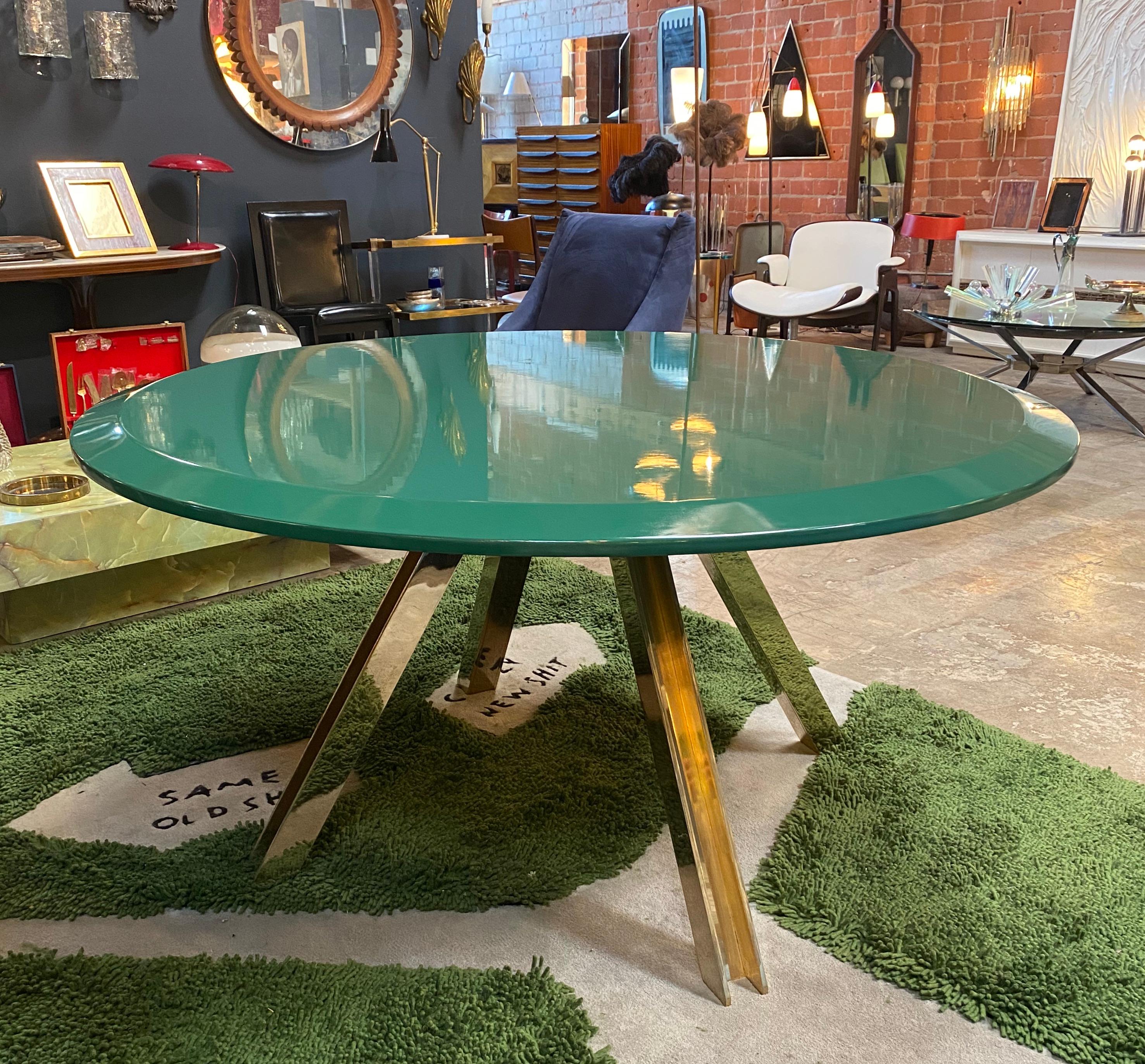 Romeo Rega attribute brass round green top centre table, Italy, 1970s.
Sleek center and impressive geometric brass.