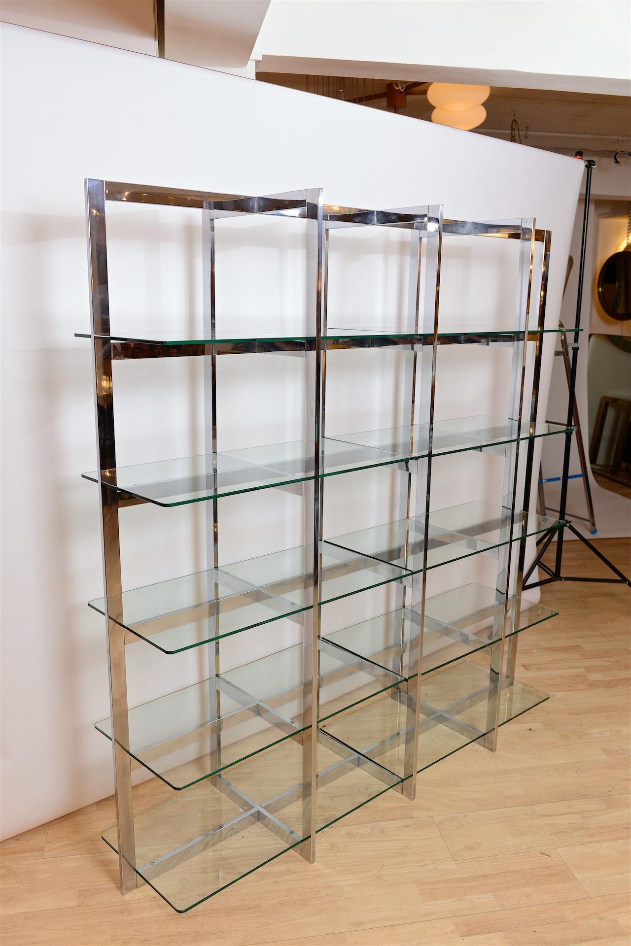 Geometric chrome and glass shelving circa 1970

Finished on all sides, can be used as a room divider or away from wall.
Shelves have depth of 48cm. 

This piece can be dismantled flat for shipping if required.


    