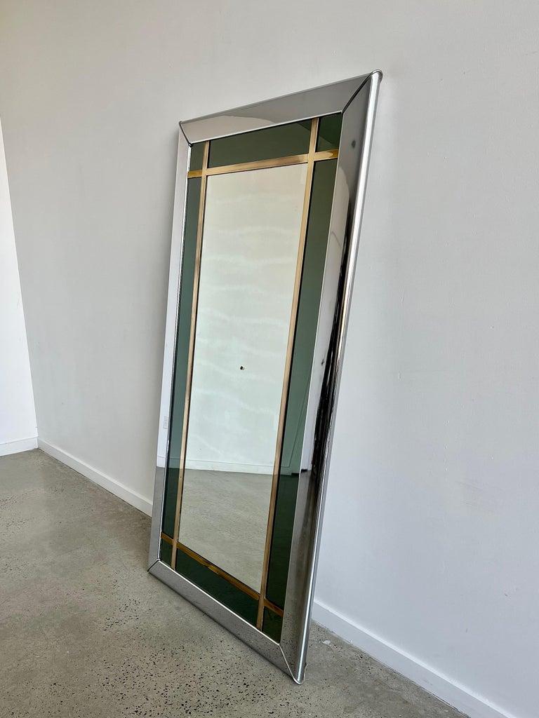 Art Deco Italian large mirror in brass frame and chrome with 2 different types of mirror, one light colour mirror and one on the sides in dark green. 
Magnificent statement mirror by Romeo Rega that can be hang horizontal or vertical.