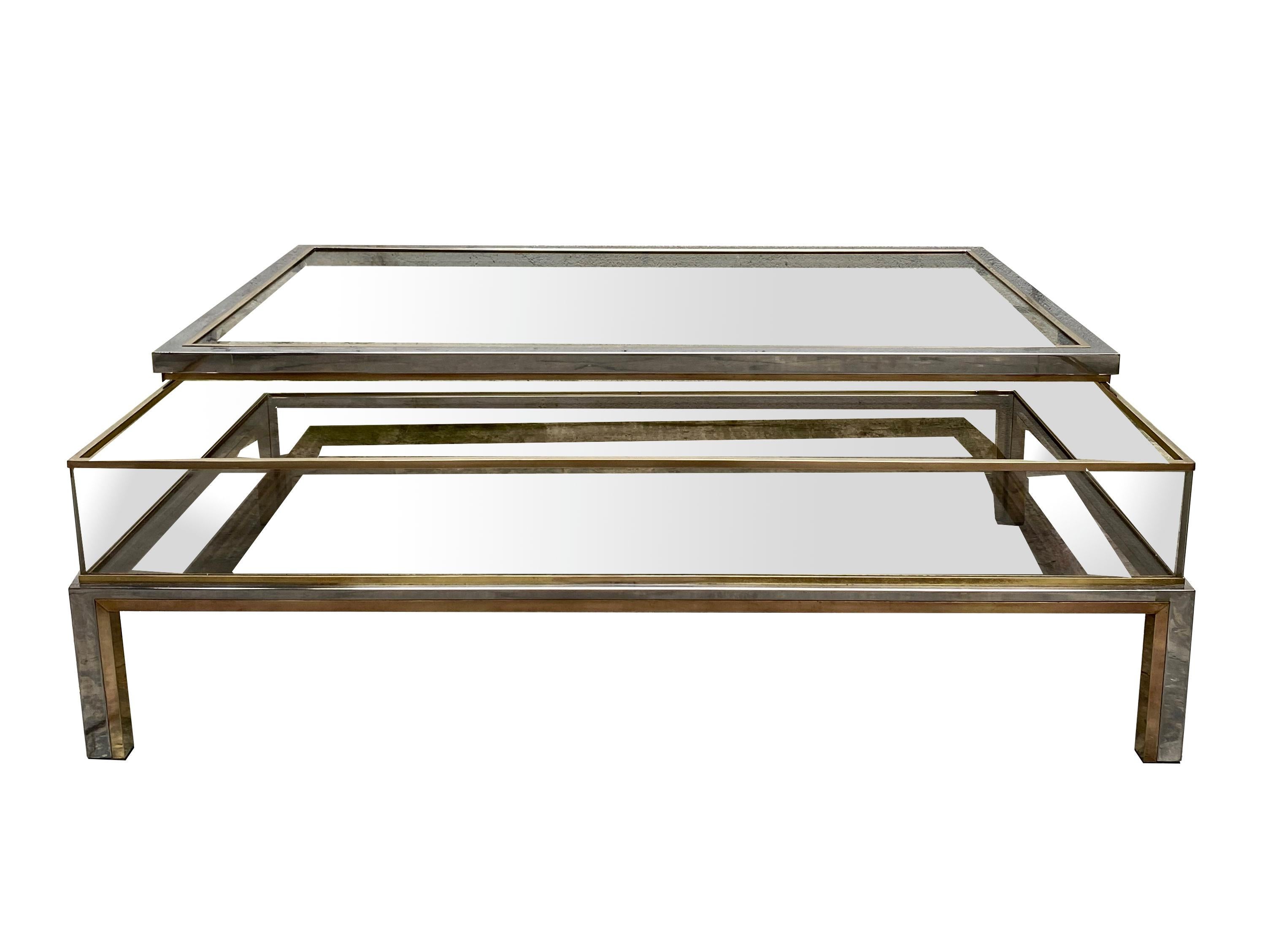 Brass, chrome-plated metal and glass coffee table/window, signed Romeo Rega. The top functions as a display case and opens on one side. Italy 1960.