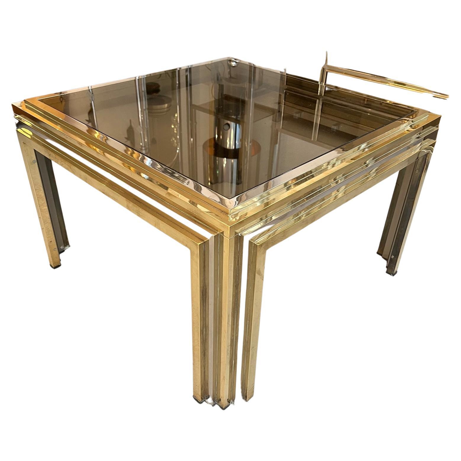 Brass, smoked glass and chrome bicolor square side table with elegant details attributed to Romeo Rega, Italy ca. 1970s
70 x 70 x 42 cm
Very good vintage condition
A matching rectangular coffee table also available in our other items.

