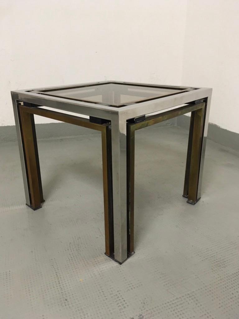 Small Romeo Rega brass, chrome and smoked glass side table, Italy, circa 1970s
Good condition.
Patinated brass, can be clean on demand.
Measures: 40 x 40 x 40 cm.
   