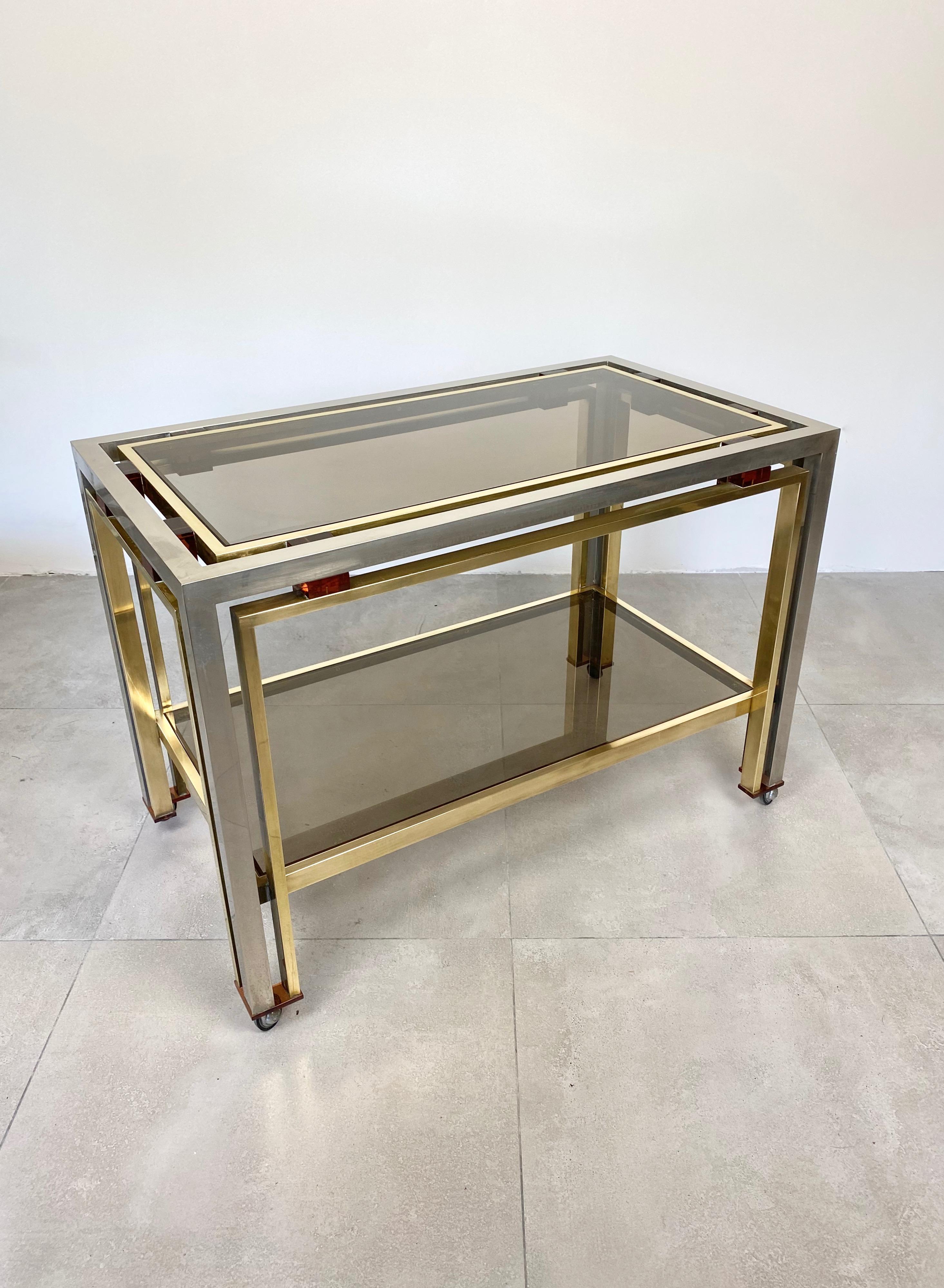 Cart table in chrome, Lucite and brass with a smoked glass surface by the Italian designer Romeo Rega, Italy, 1970s.