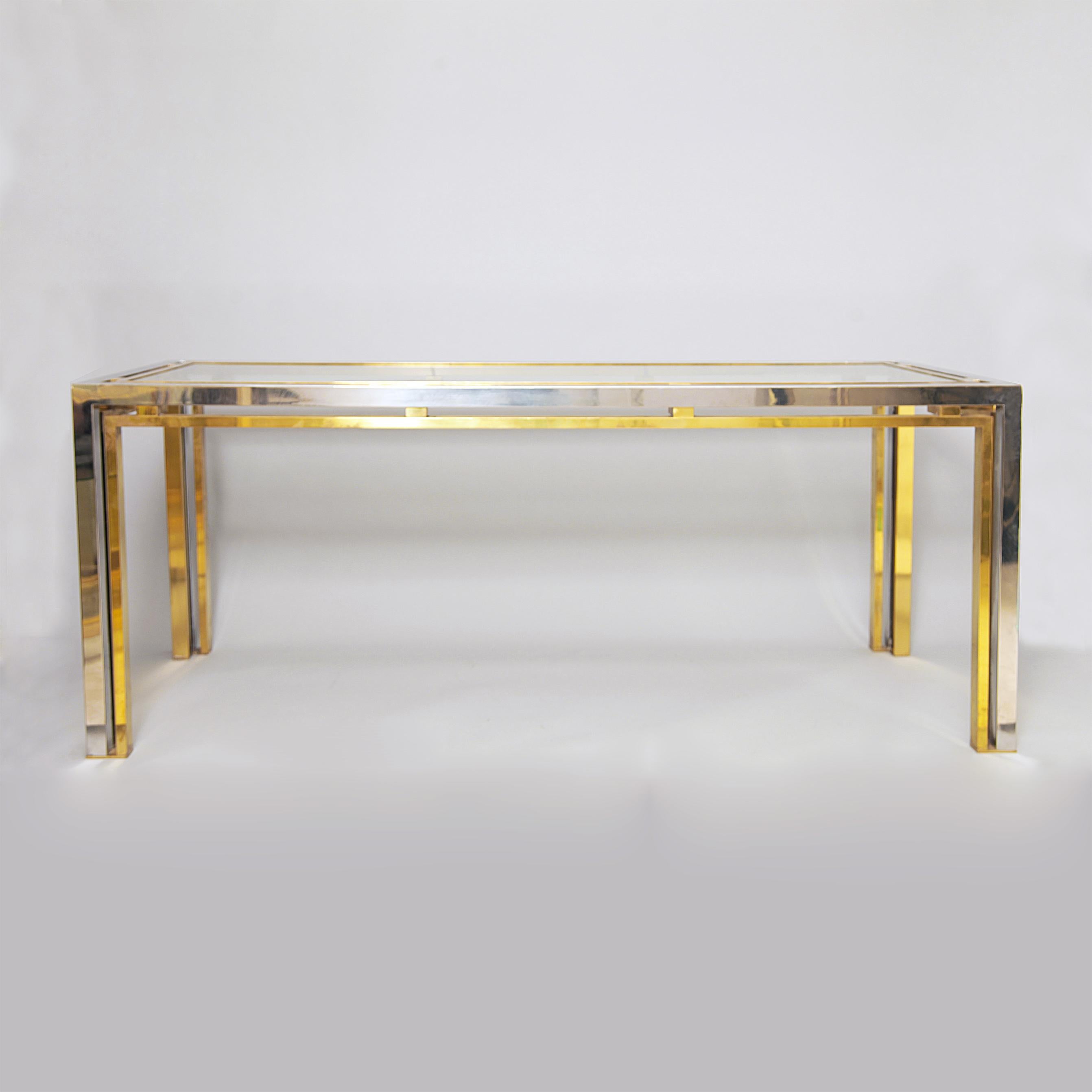 Chrome and brass rectangular console table or desk attributed to Romeo Rega. Clear glass top. This amazingly elegant piece can either be used as a console table or an office desk, either way it will look great!