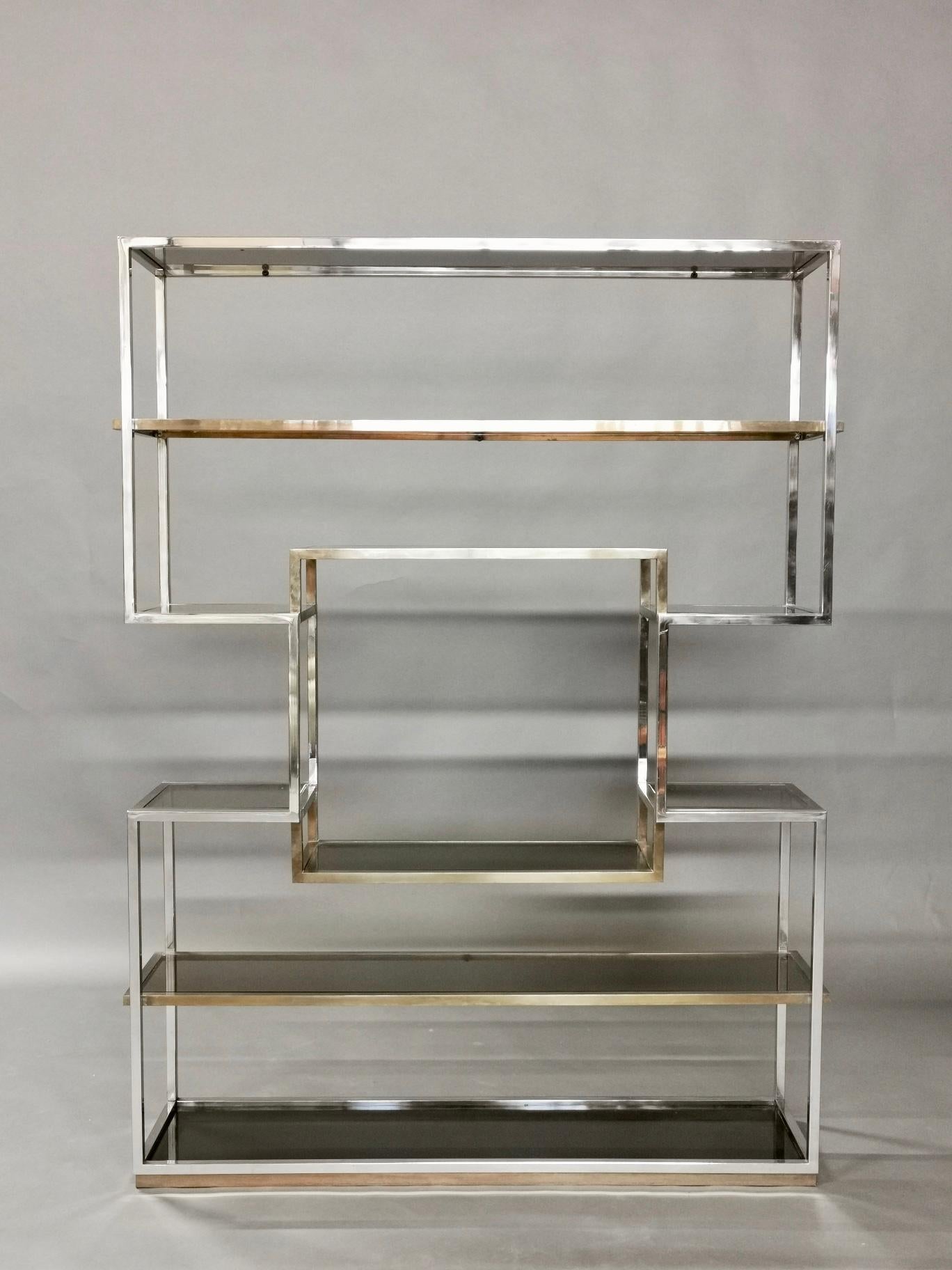 Geometric shelf by Italian designer Romeo Rega, manufactured in brass, chrome and smoky glass, nice and decorative vintage condition.
  